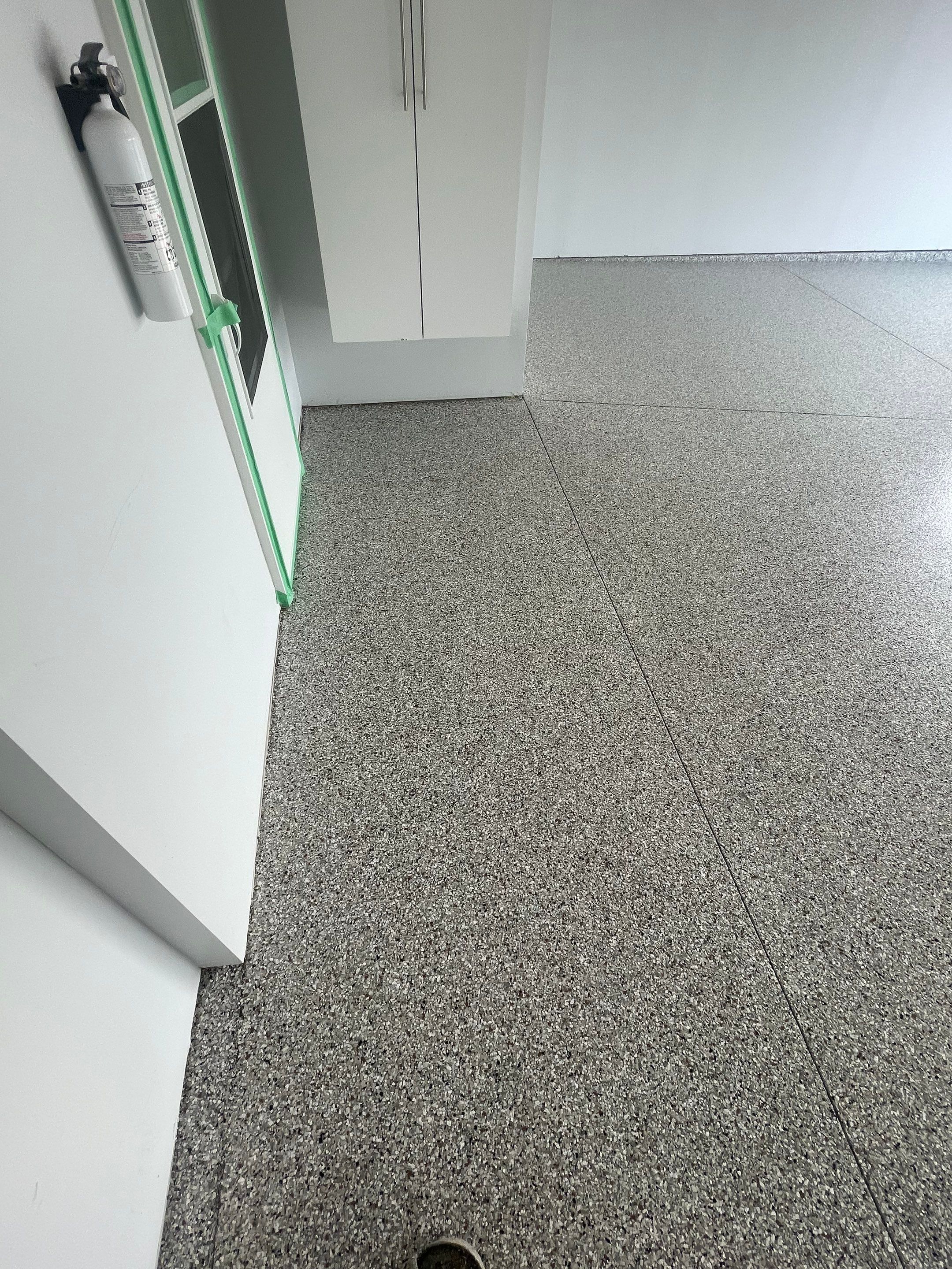 Custom Coyote Flake Garage Floor Coating in Sioux Falls by Select Painting, Coatings & Garage Cabinets