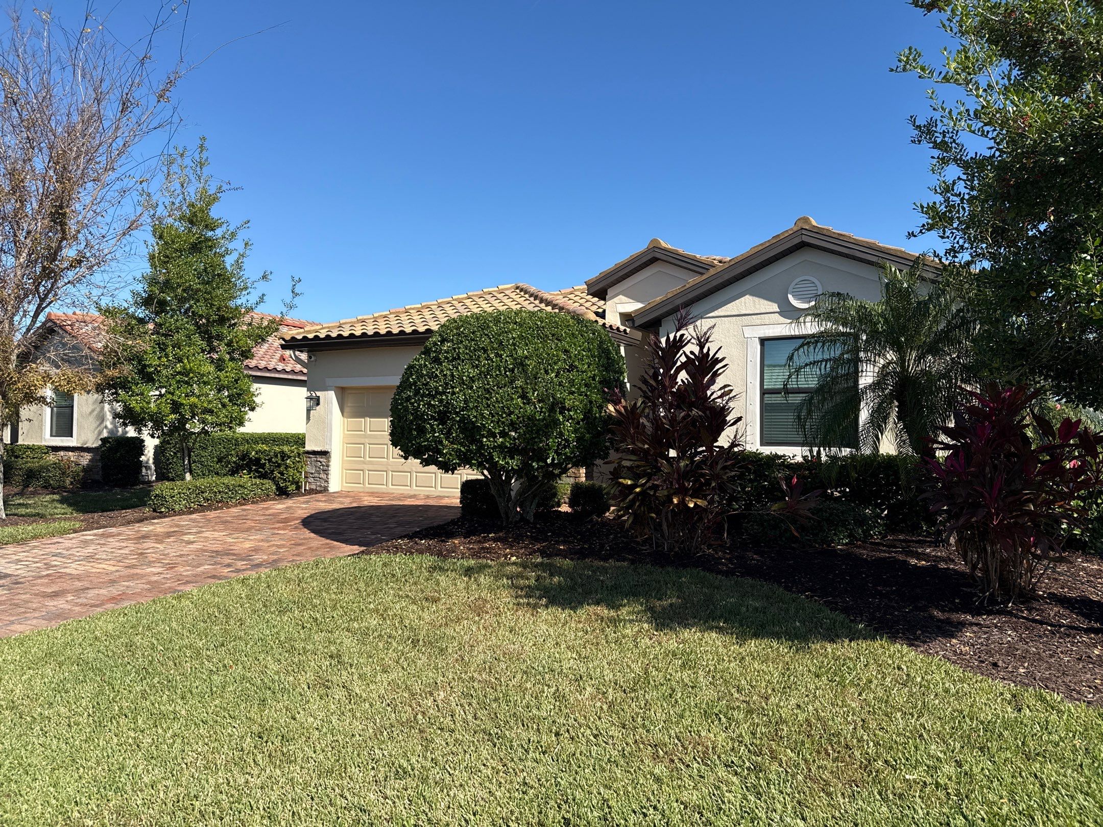Barrel Tile Roof Cleaning & Paver Driveway Cleaning in River Strand at Heritage Harbour | Bradenton, FL by Sunshine AquaWash