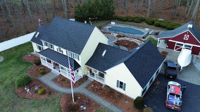Chelmsford Premium Roof: Onyx Black Shingles with Standing Seam Metal Porch