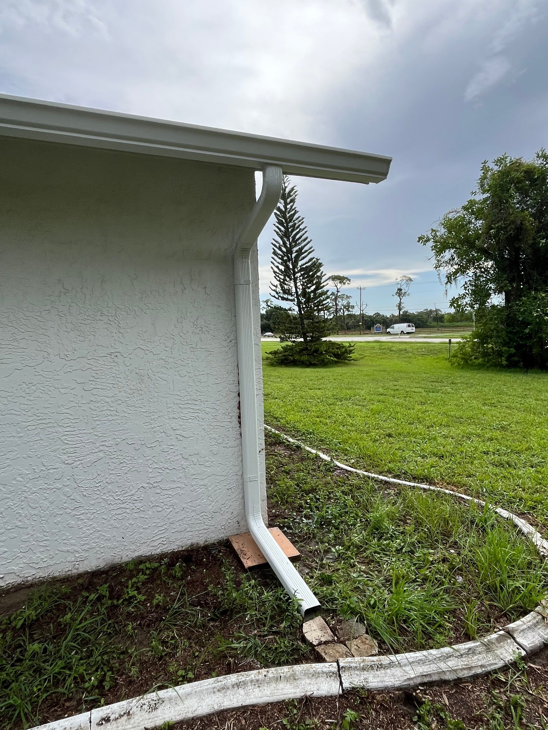 White Seamless Gutters with Splash Guards in North Fort Myers FL by Gutter Professor   by Gutter Professors