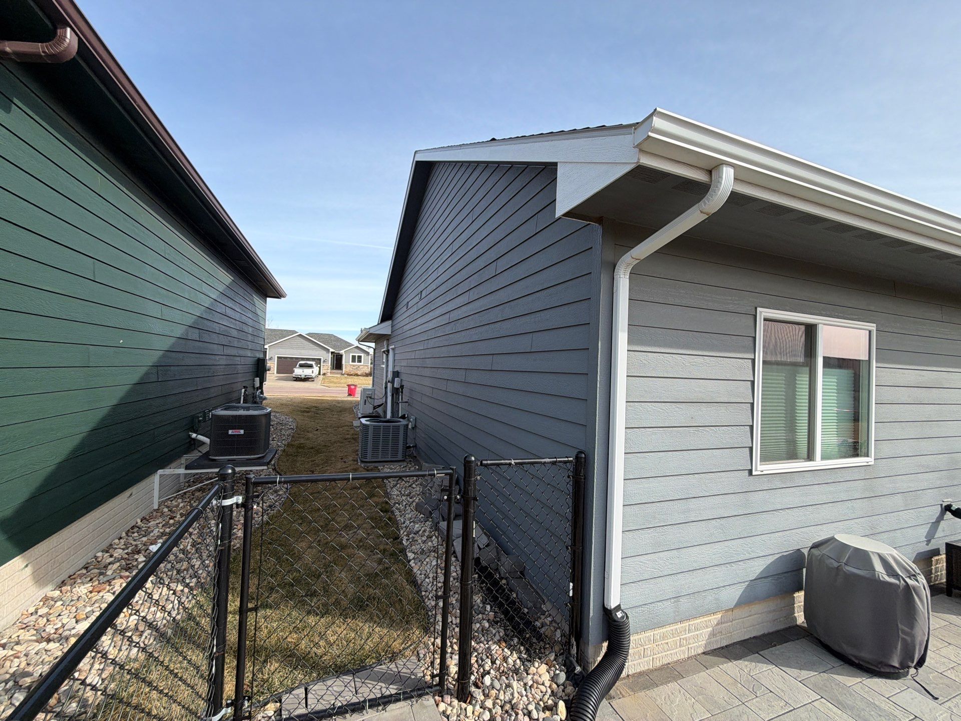 Residential Exterior Painting and Siding Refresh in Sioux Falls by Select Painting, Coatings & Garage Cabinets