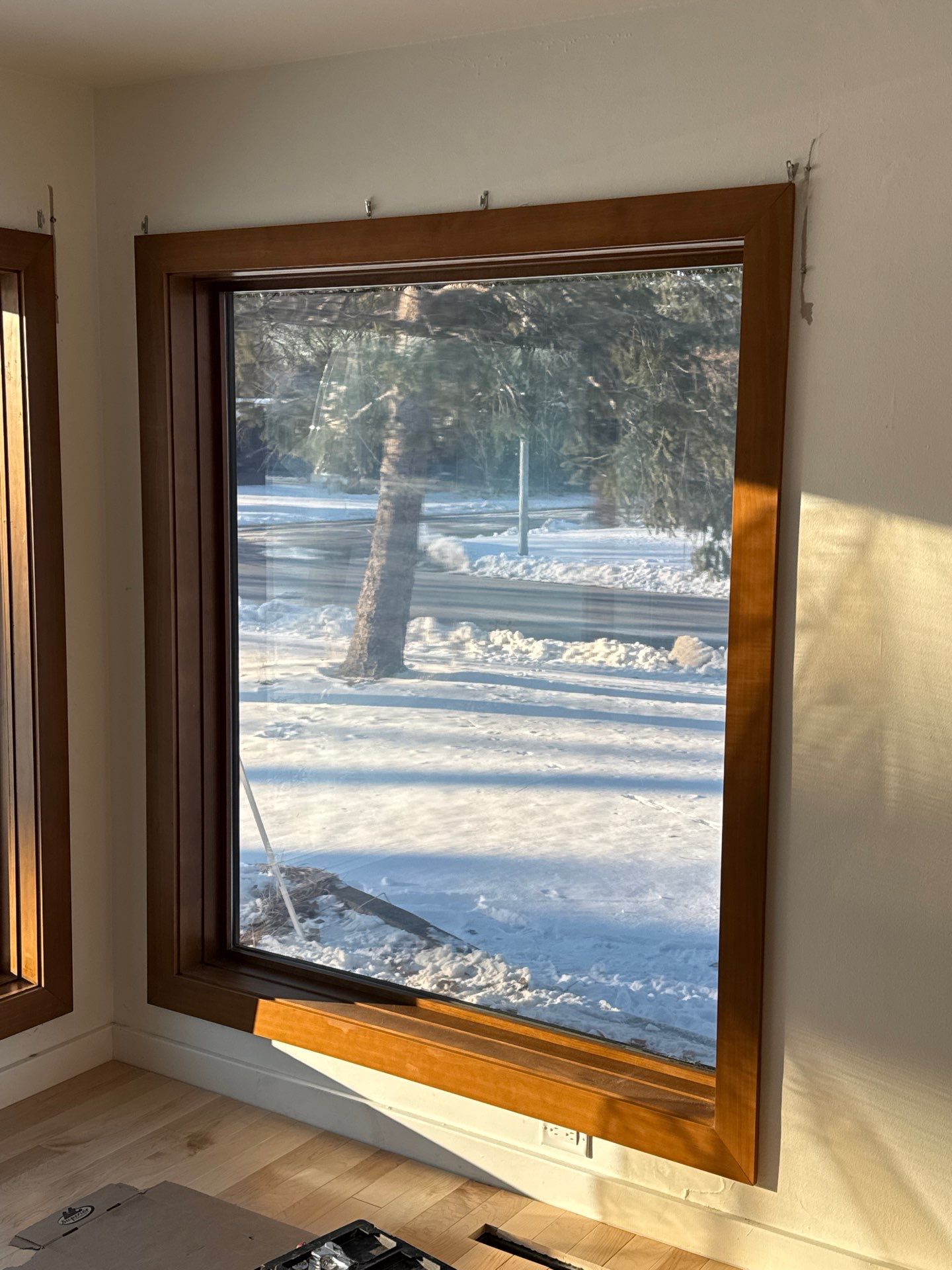 Black-Frame Pella Lifestyle Upgrade on a Partial Brick Home by United Windows and Siding LLC