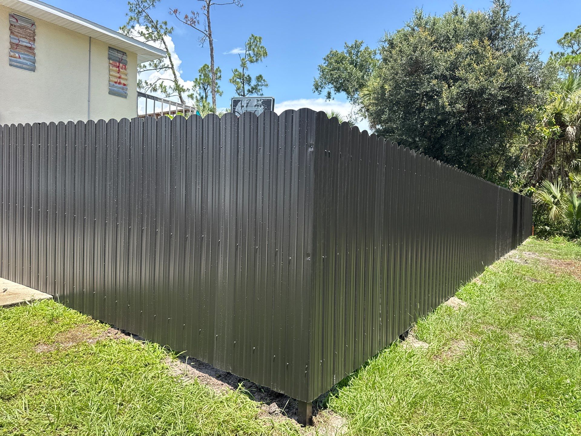 Bronze Scalloped Metal Privacy Fence Installation in North Port by True Fence LLC