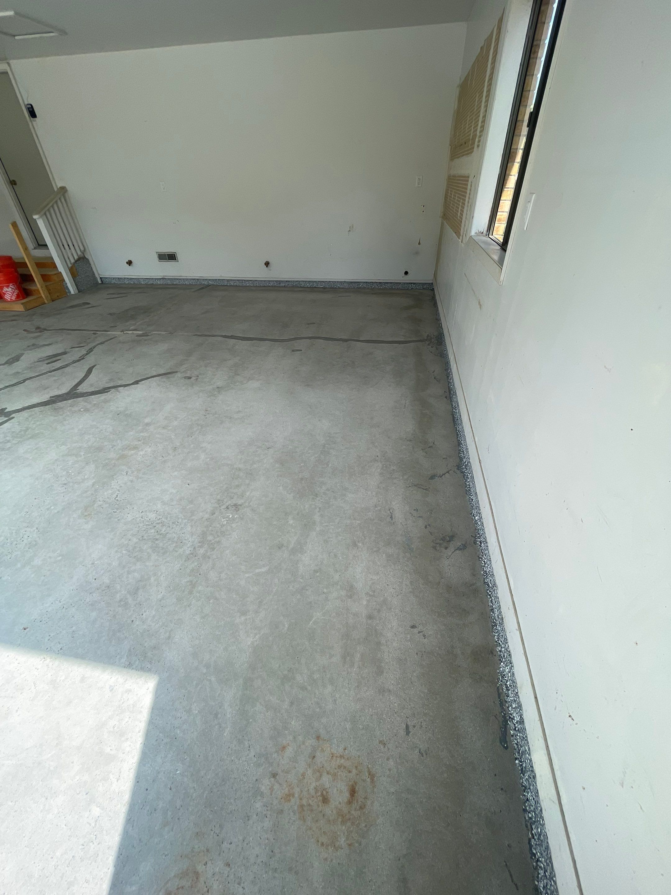 Grey Speckled Concrete Coating for Residential Garage in Yankton by Select Painting, Coatings & Garage Cabinets