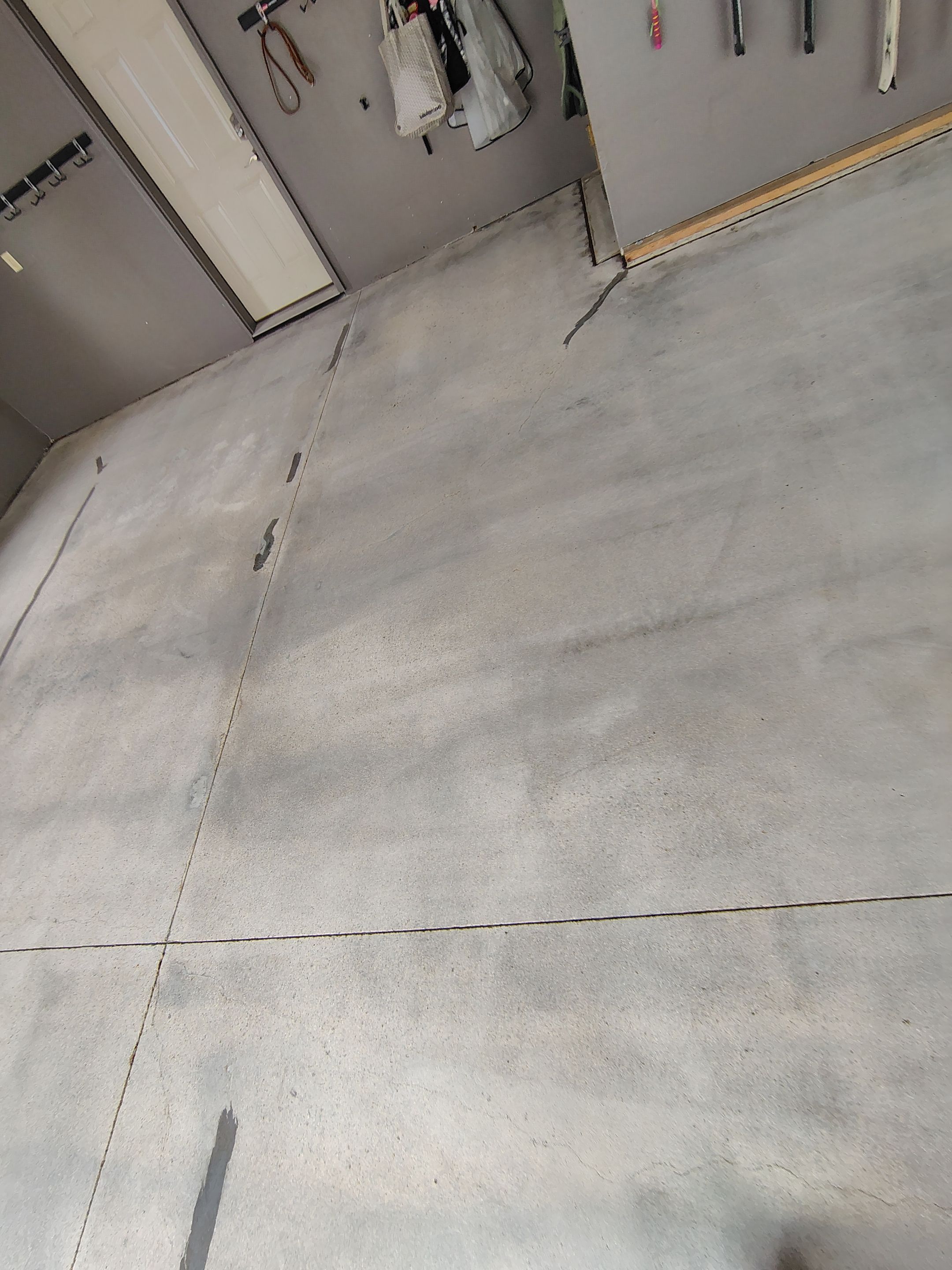 Garage Floor Concrete Coating and Crack Repair in Sioux Falls by Select Painting, Coatings & Garage Cabinets