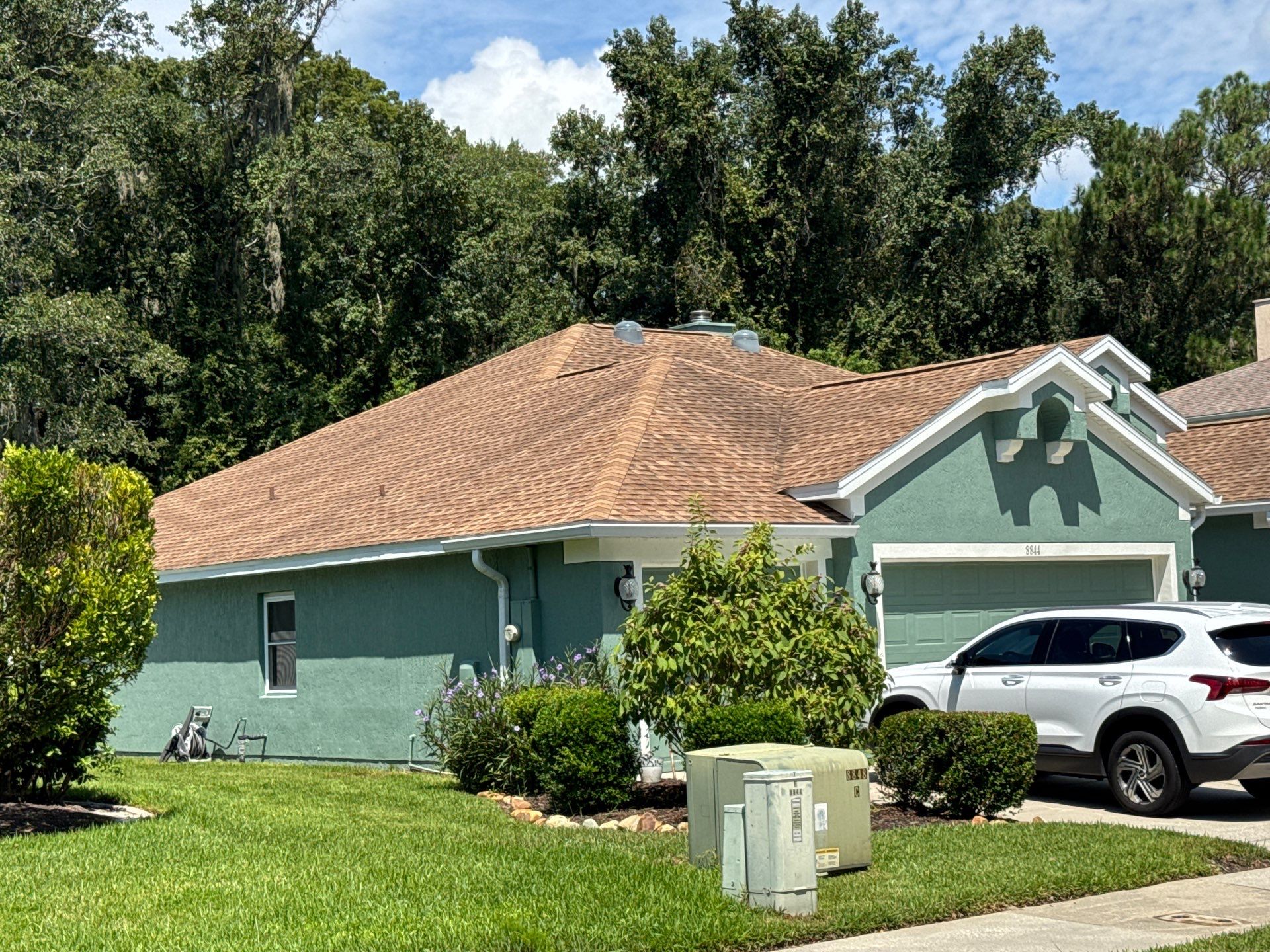 Stucco Exterior Repainting with White Soffits & Fascia | Hampton Park, Jacksonville, FL by A New Leaf Painting, LLC