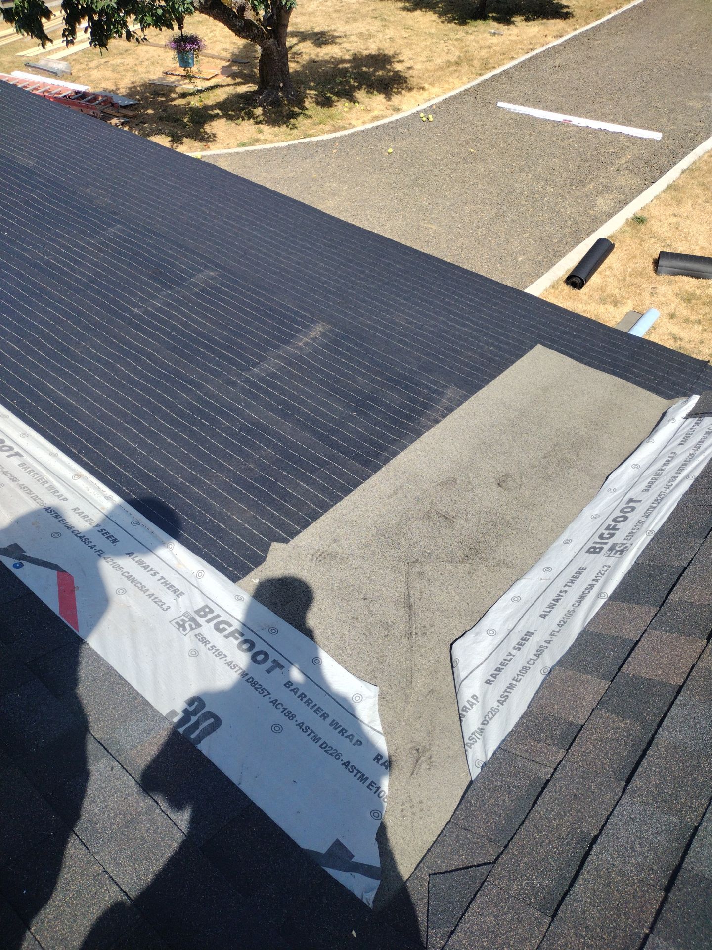 Residential Roof Replacement with Metal Accents by Orezona Building & Roofing Company, Inc.