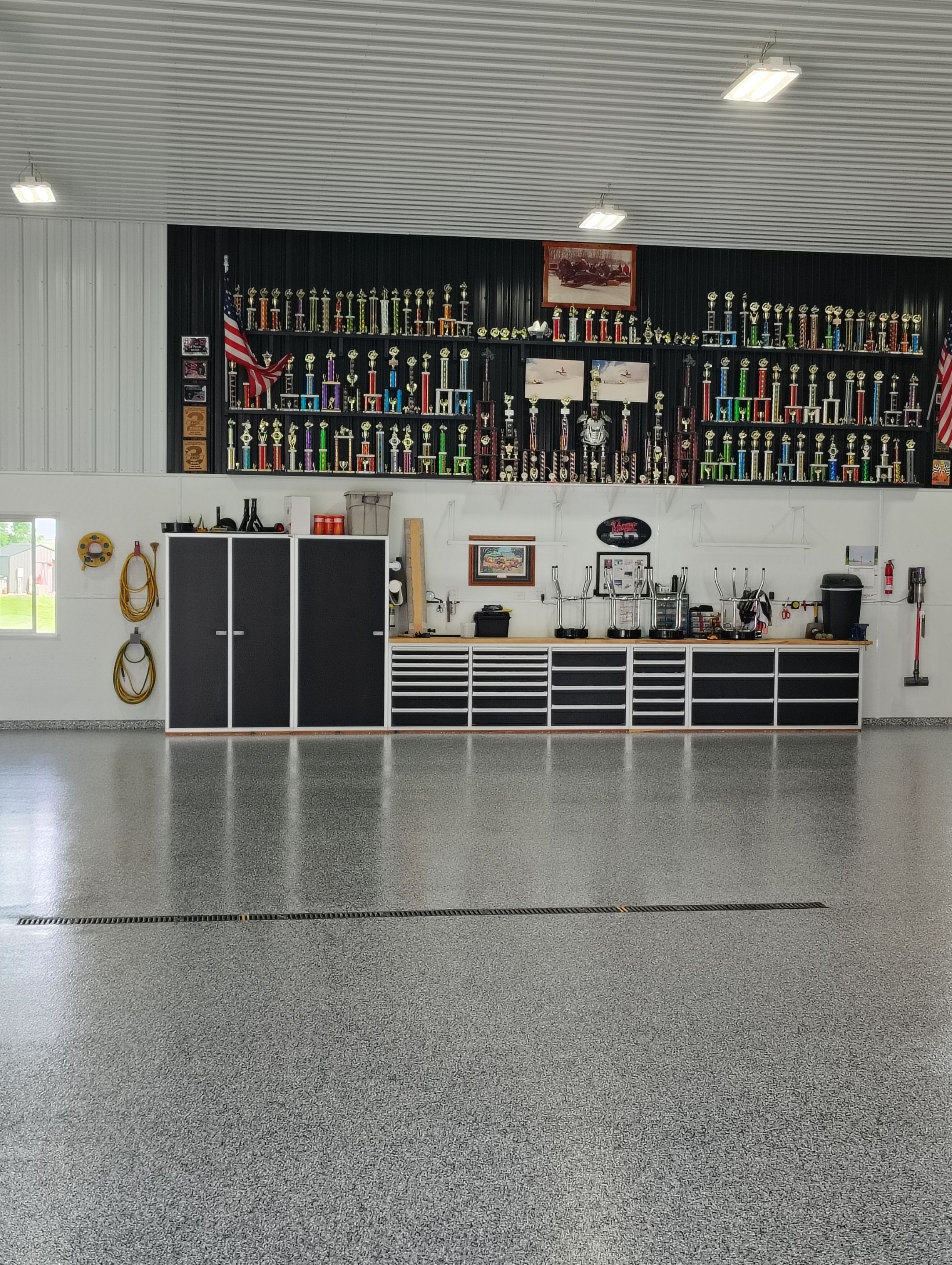 Multi-Stage Concrete Floor Coating for Egan Shop and RV Storage by Select Painting, Coatings & Garage Cabinets