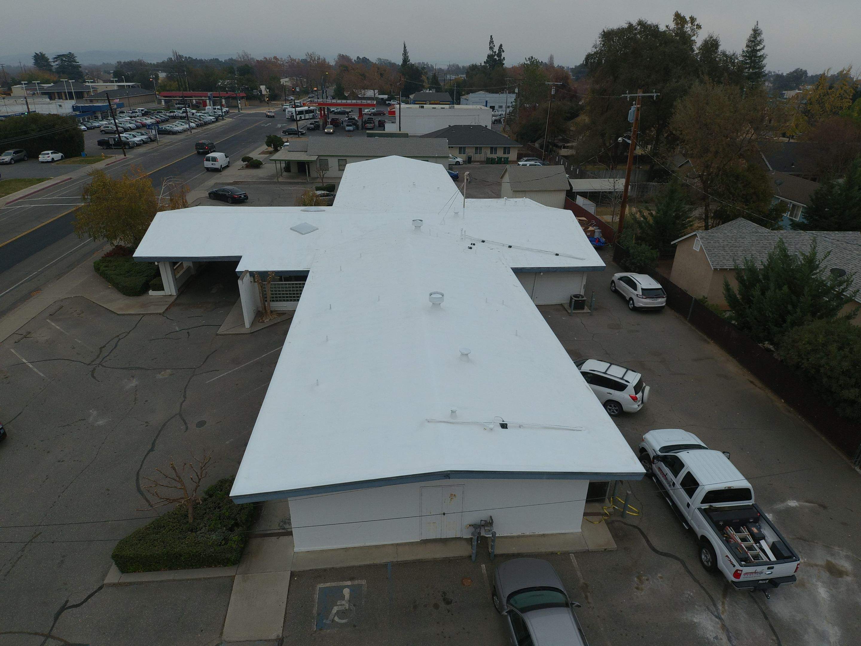 Spray foam and coatings using Conklin Benchmark/PUMA XL coatings and spray foam by Straight Edge Roofing Inc