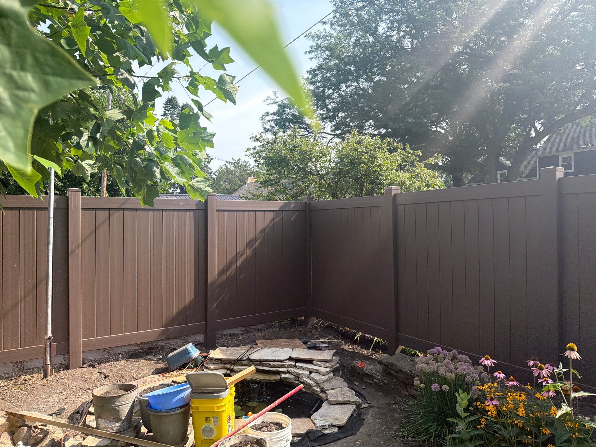 Walnut Vinyl Privacy Fence Installation in Waterloo by Perfect Picket Fence and Stain