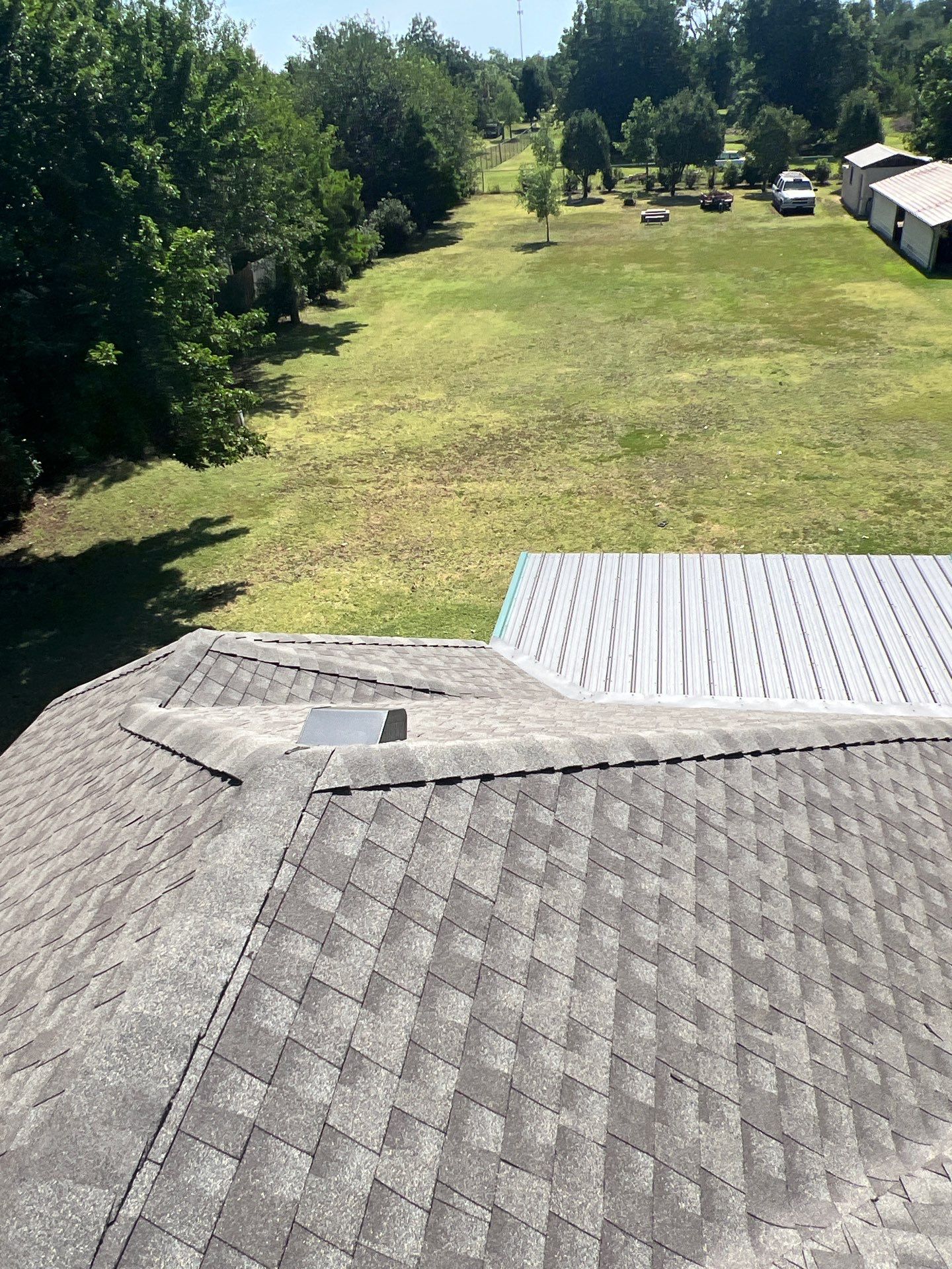 Roof Replacement and Gutter Installation in Edmond, OK by McCann's Roofing and Construction