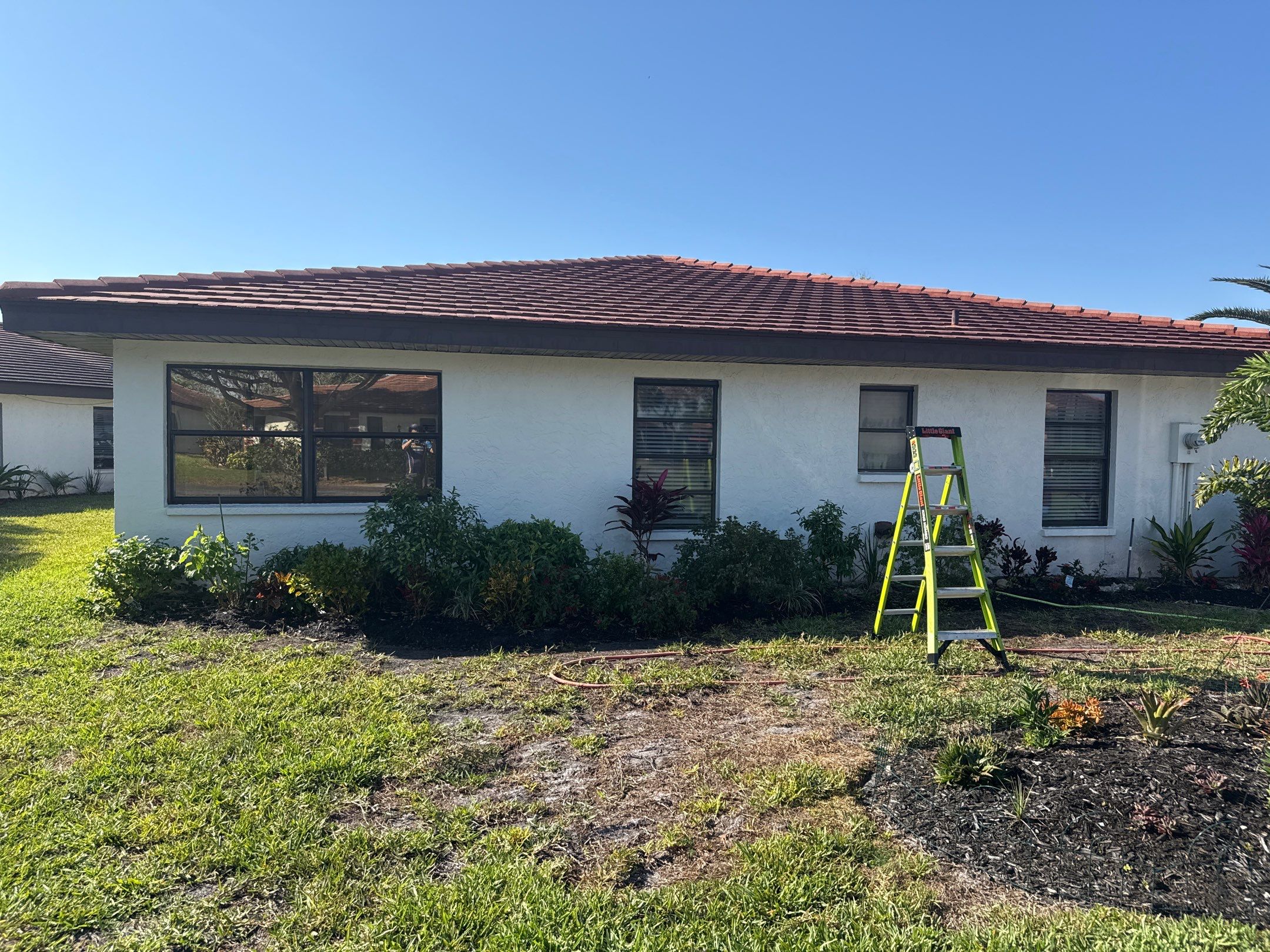 Tile Roof Cleaning – Vivenda at Bradenton I (5-Star Review & Plant Protection) by Sunshine AquaWash