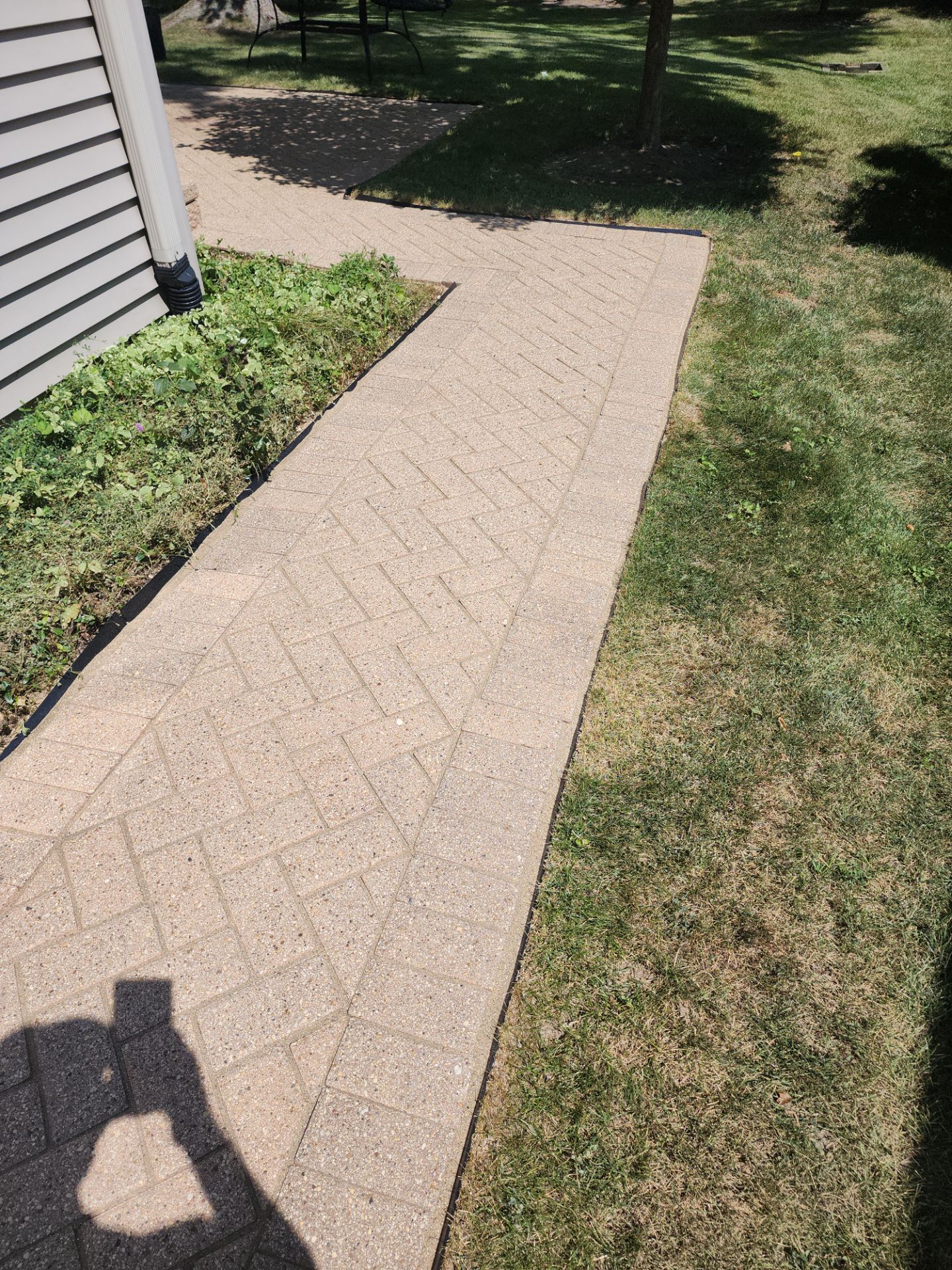 Arlington Heights Brick paver repair, cleaning and sealing by Northern Power Washing LLC.