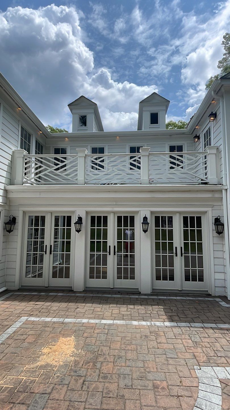 Gutter Installation using 5"white K style seamless gutters and 2x3 white leaders by Above All Gutters 