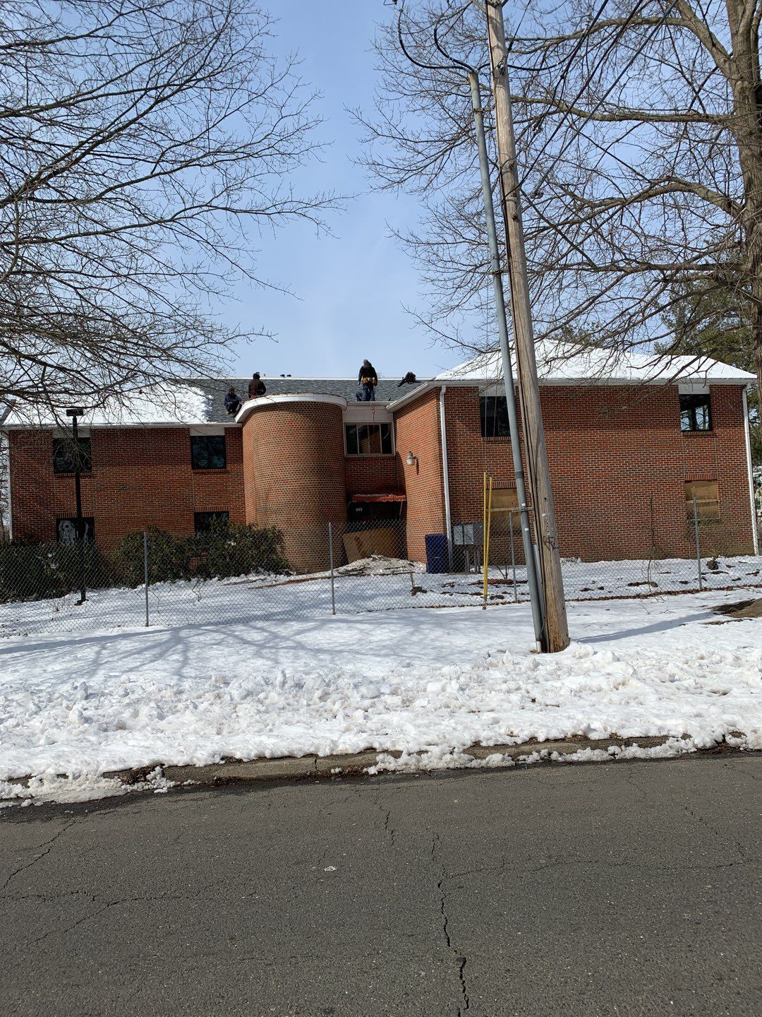 Commercial Roofing Installation using EPDM with white gutters by A Plus Exterior