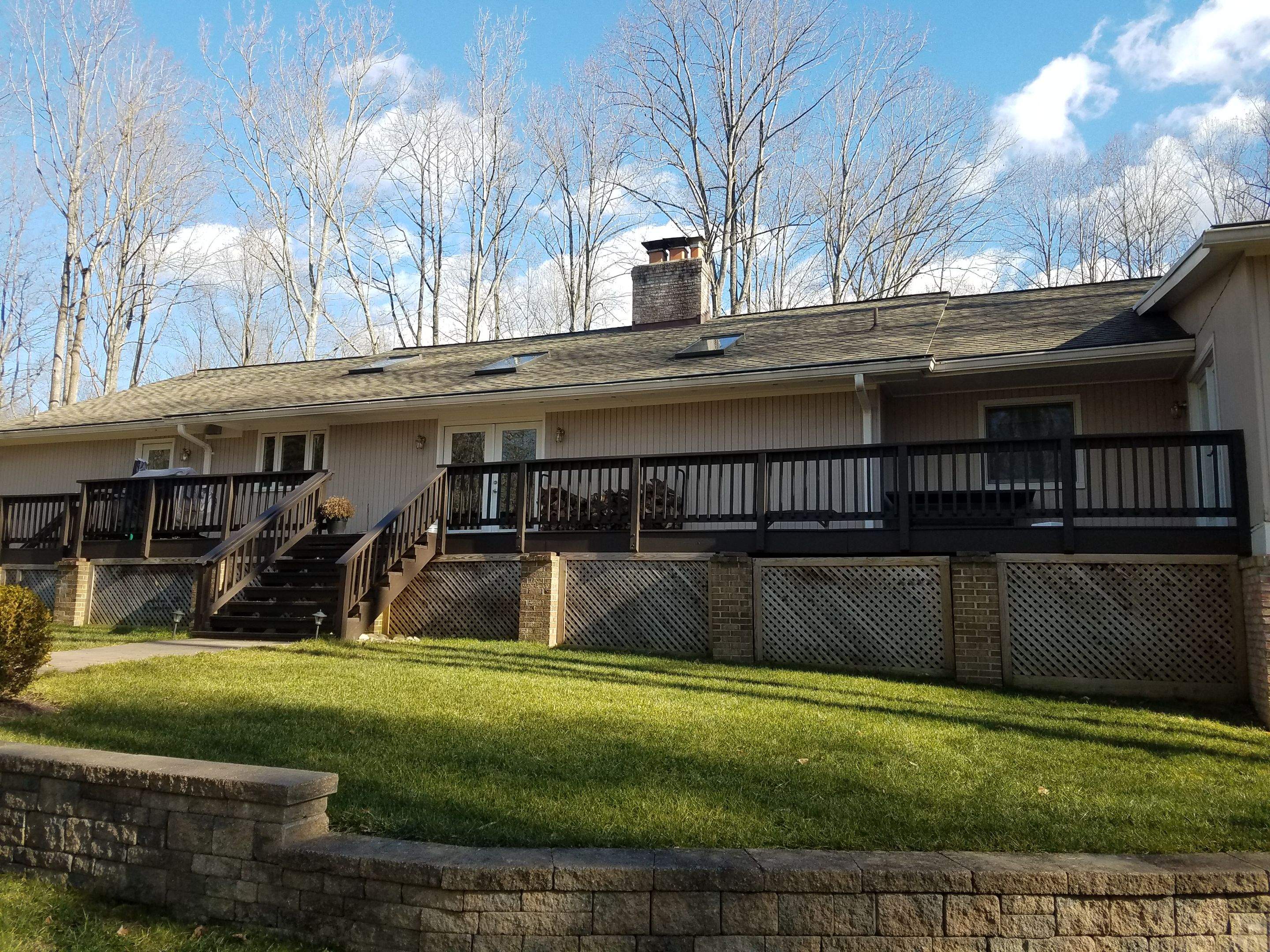 Roof, Siding, Door, and gutter replacement by American Home Contractors