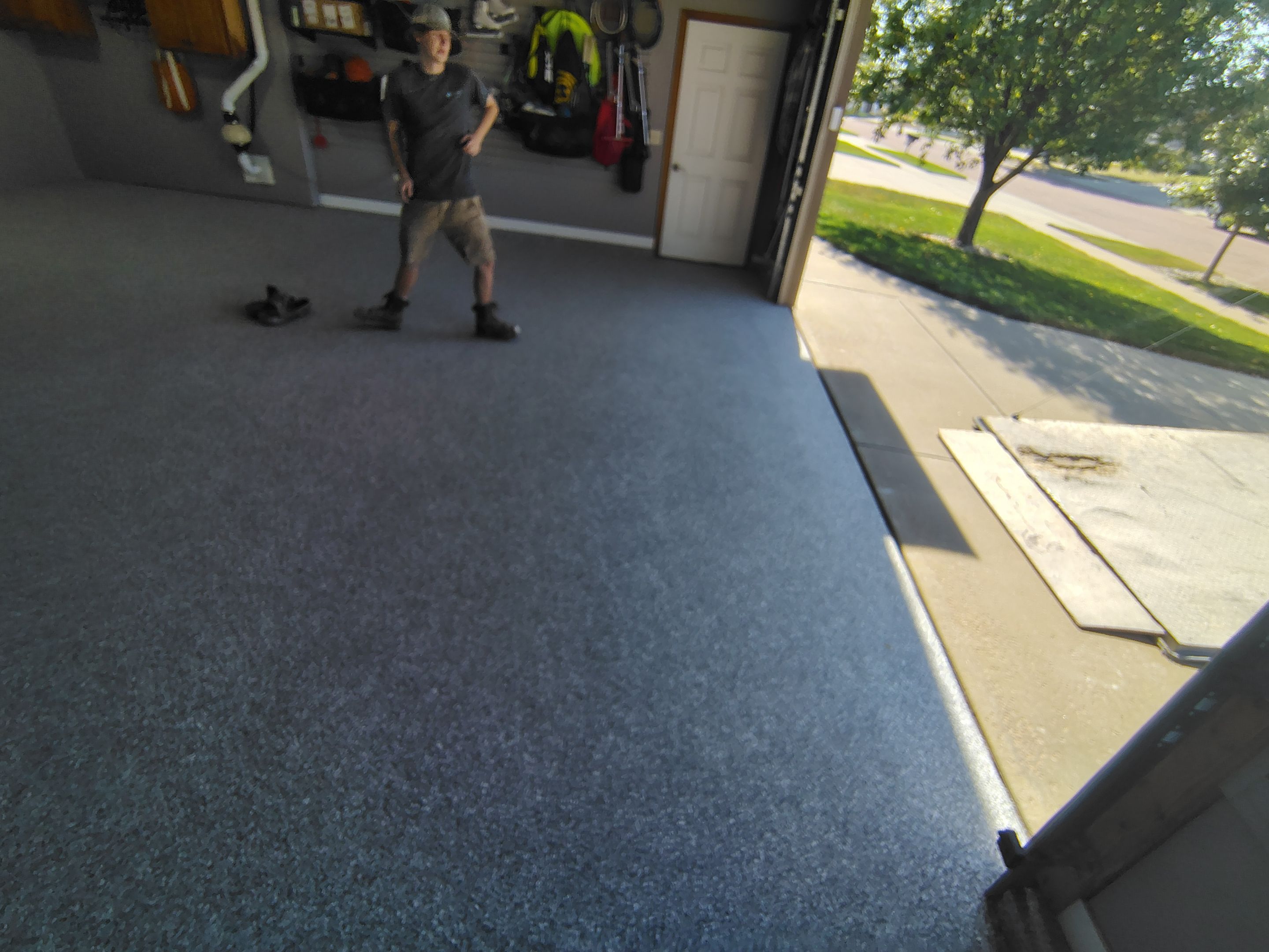 Grey Flecked Epoxy Garage Floor Installation in Sioux Falls by Select Painting, Coatings & Garage Cabinets