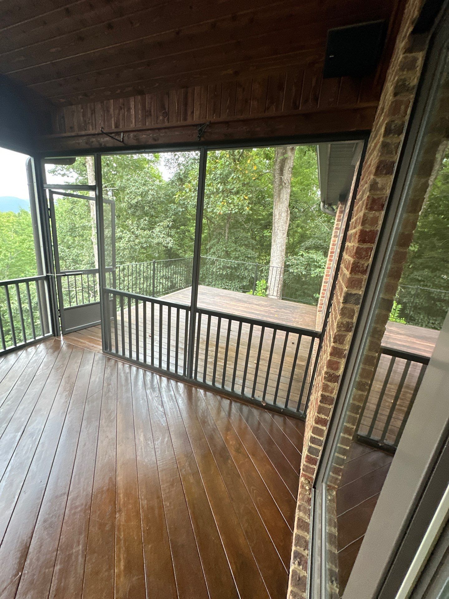 Wood Deck Refinishing and Black Metal Railing Upgrade in Travelers Rest by Painter1