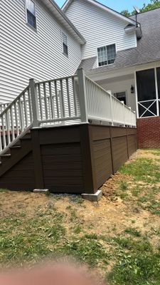 Custom Composite Deck and White Vinyl Railing Installation in Fayetteville by Walnut Hollow Decks & Outdoor Living