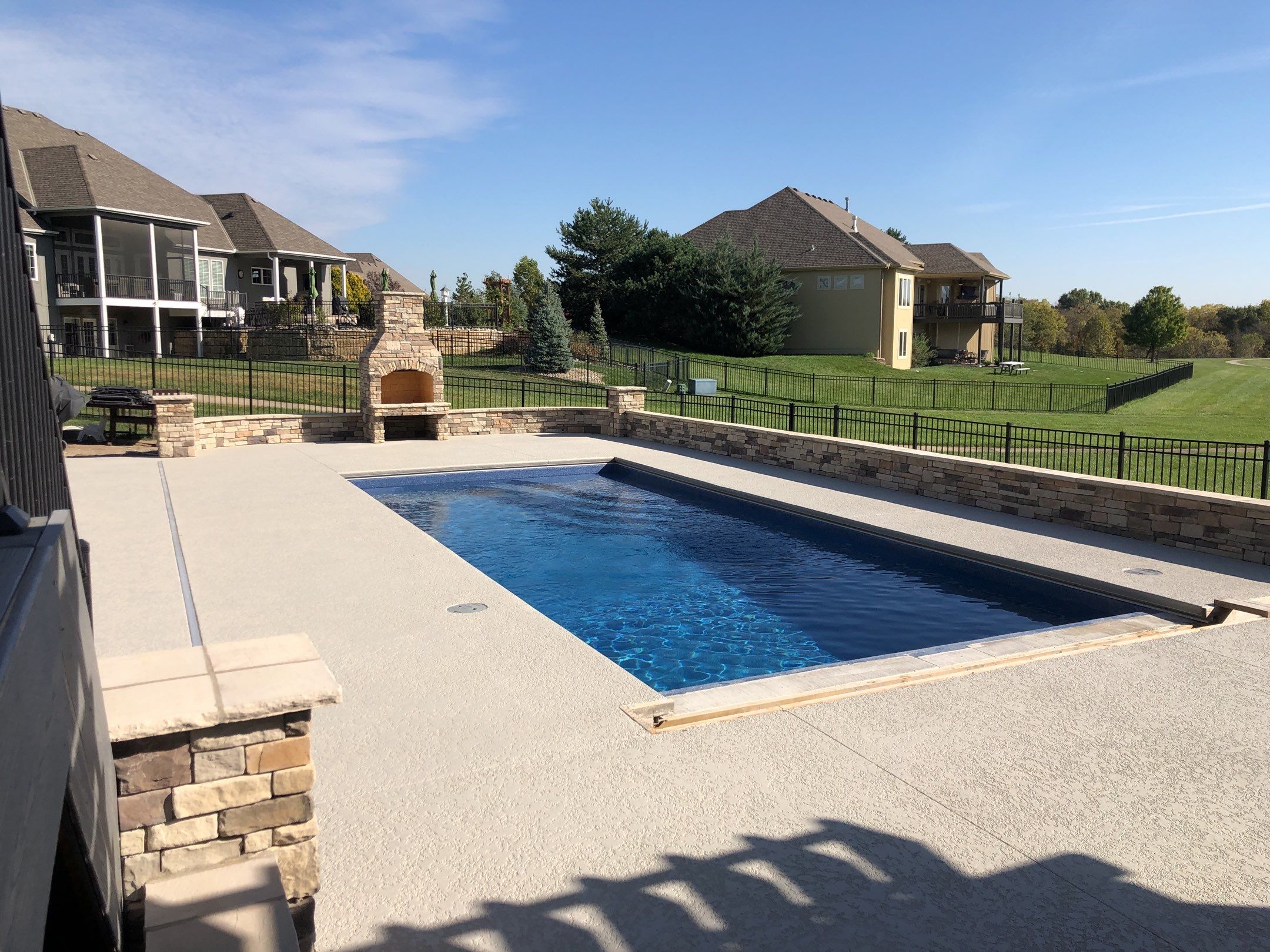 Parkville, MO -- Pool Deck Coating with Classic Texture (knockdown) finish by Big Red Decorative Concrete, LLC