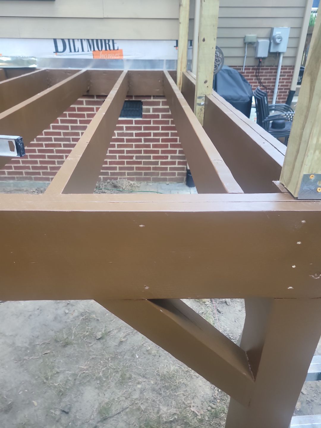 Fuquay-Varina Outdoor Upgrade – Composite Deck & Paved Landing by Elite Remodeling and Design LLC