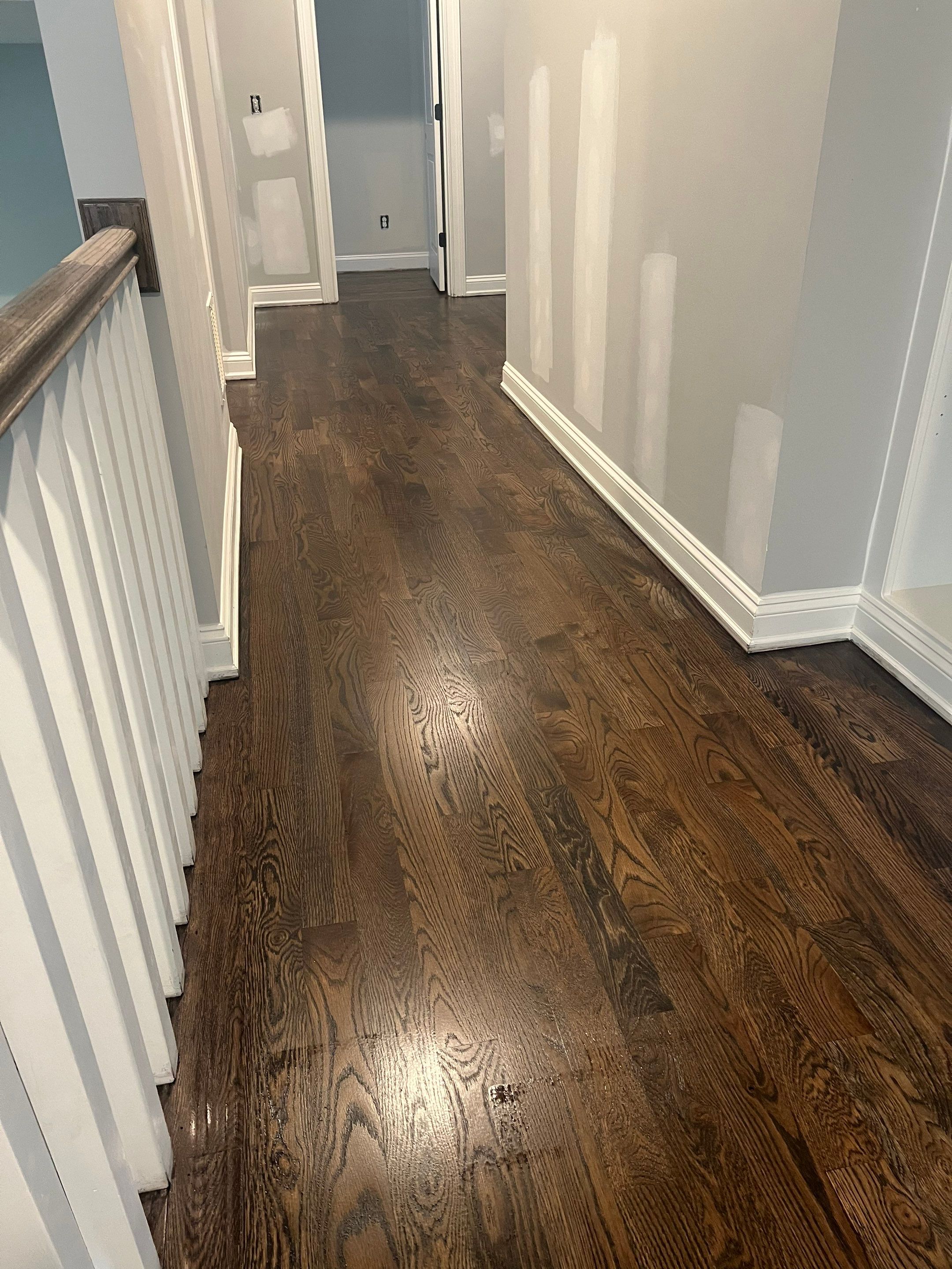 Adding hardwood floors to bedrooms by Accent Custom Floors