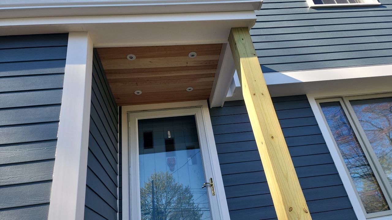James Hardie siding, new metal roof and couple windows being installed. by UBrothers Construction