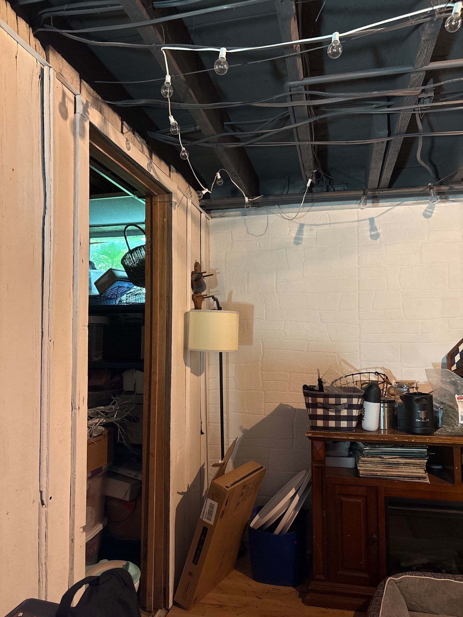 Wanamingo Basement Renovation with Exposed Ceilings and Wood Paneling by CompanyCam Sales Demo