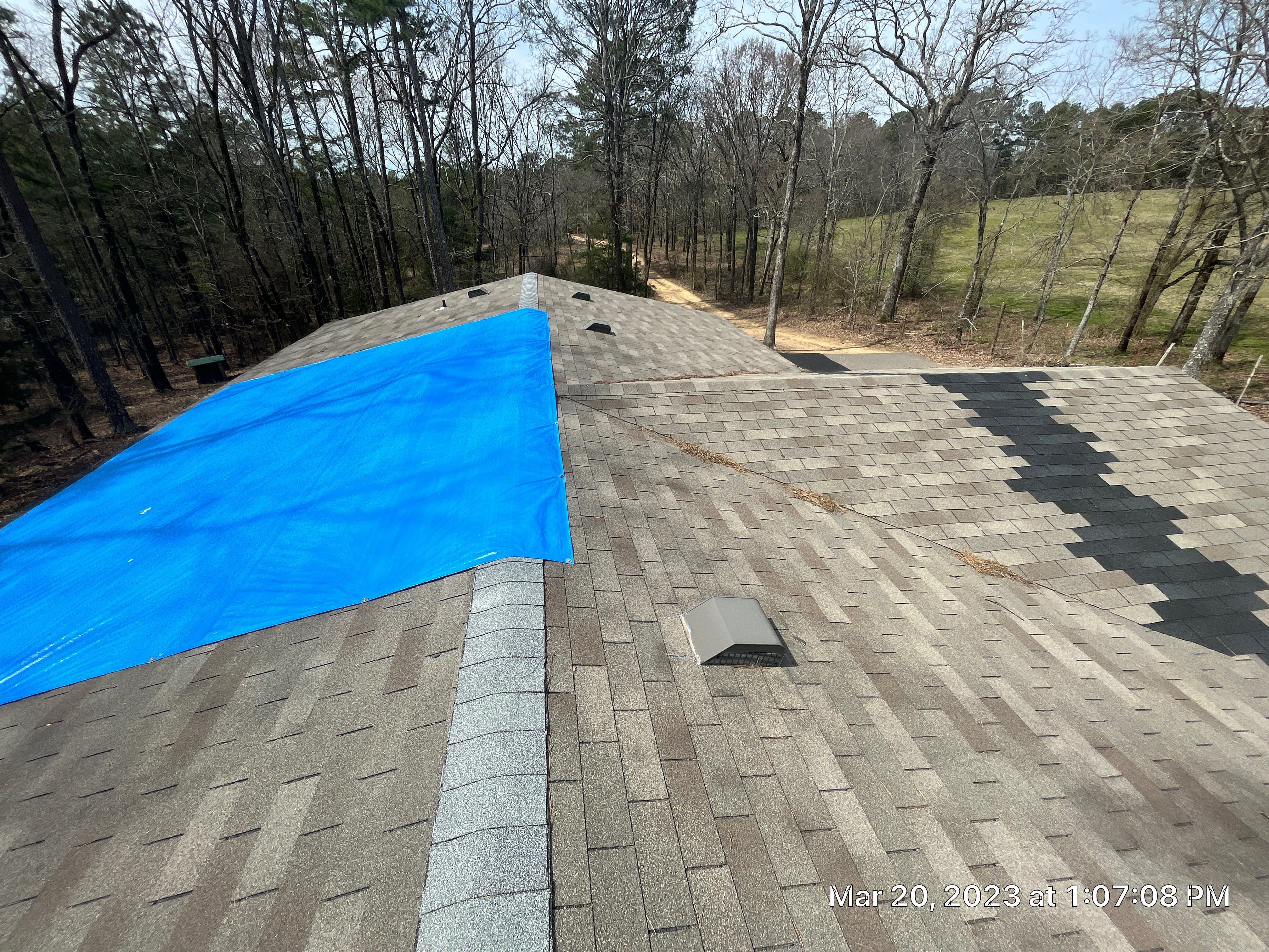 Residential Roofing Installation using 26 Gauge Colored Panels by Hostetler Roofing