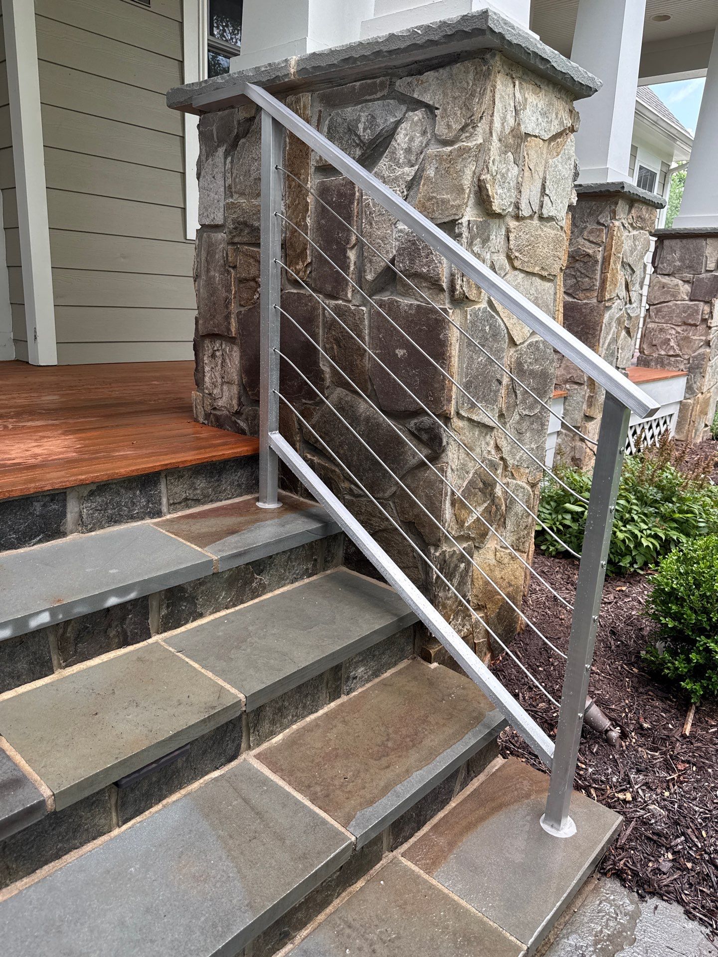 Custom Stone Porch Steps with Modern Cable Railing in Falls Church by Capitol Iron Works
