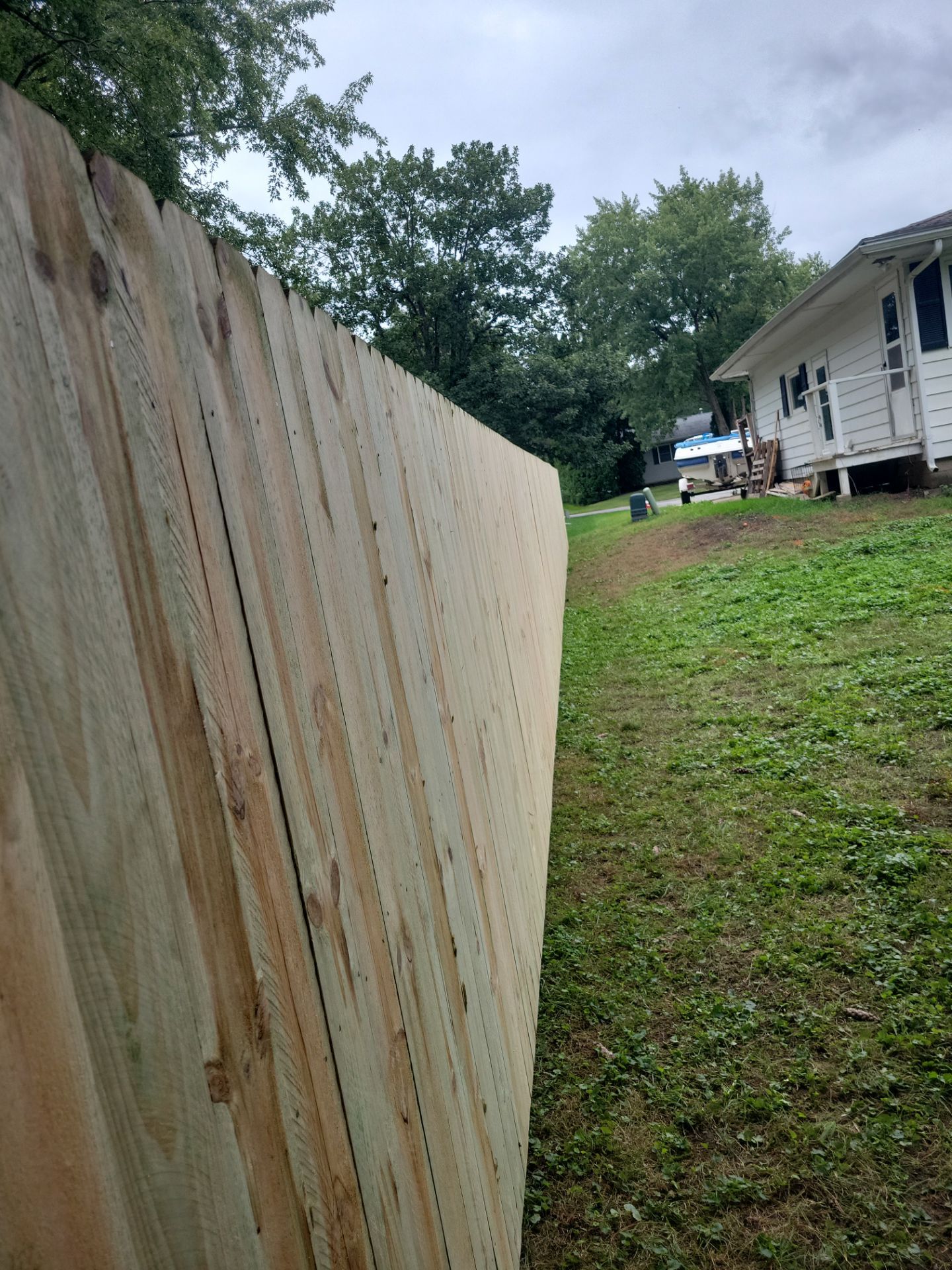 Pressure-Treated Wood Privacy Fence Installation in Waverly by Perfect Picket Fence and Stain