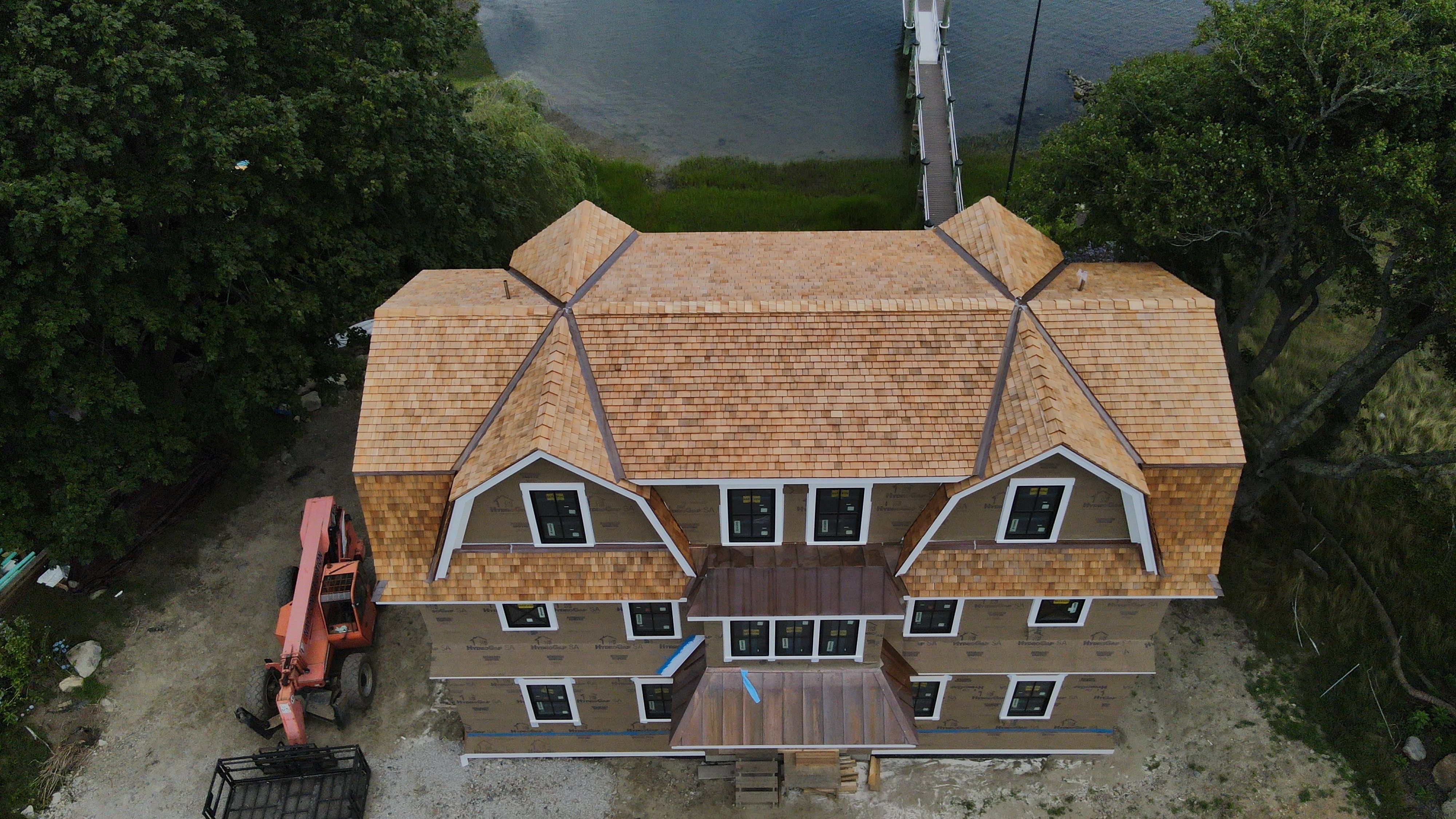Great Island - Red Cedar Roofing, Yellow Cedar Siding, Standing Seam Copper, & Copper Gutters  by Rinaldi Brothers