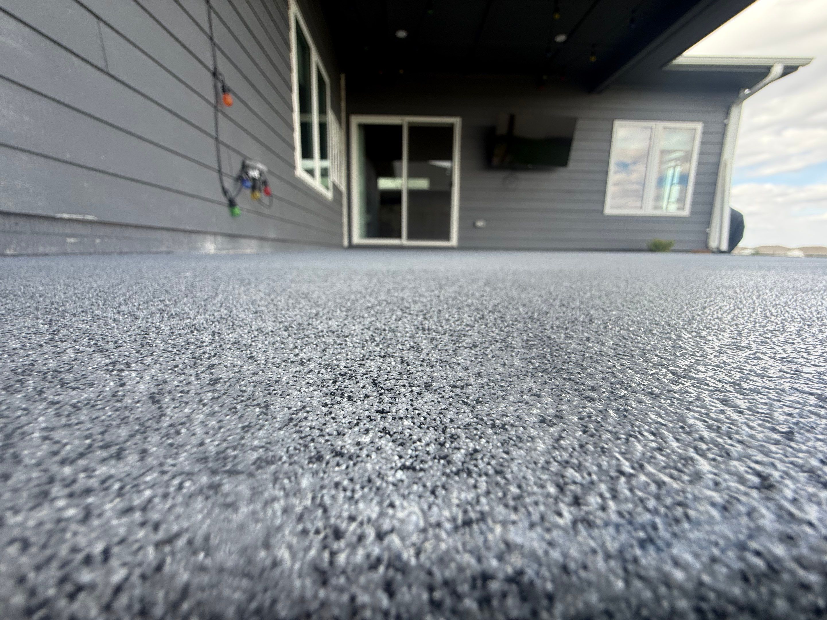 Decorative Flake Concrete Coating for Sioux Falls Porch and Patio by Select Painting, Coatings & Garage Cabinets
