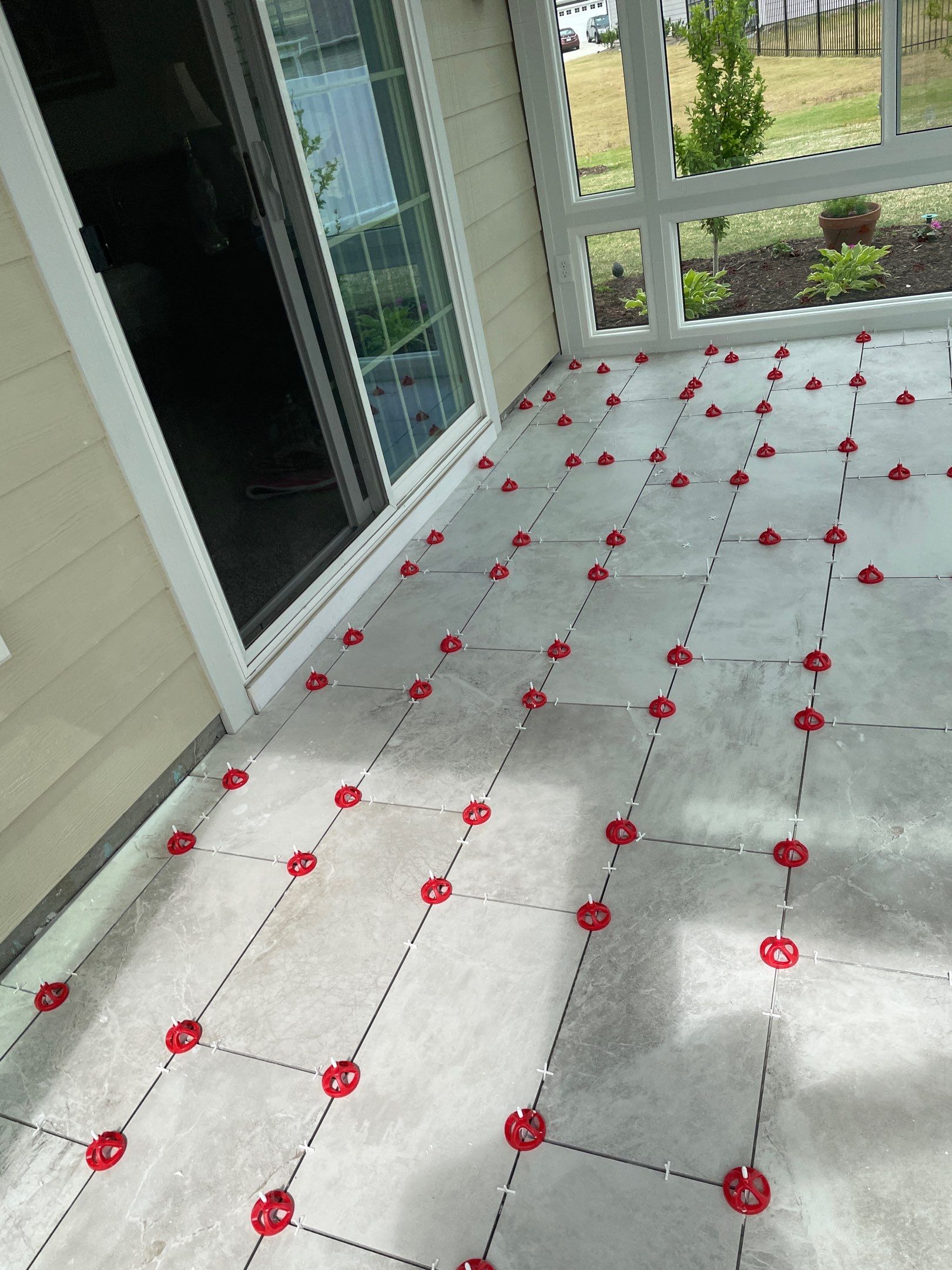 Amazing Tile Transformation After Enclosed Windows Added to Sunroom by Footprints Floors of Coastal Carolina