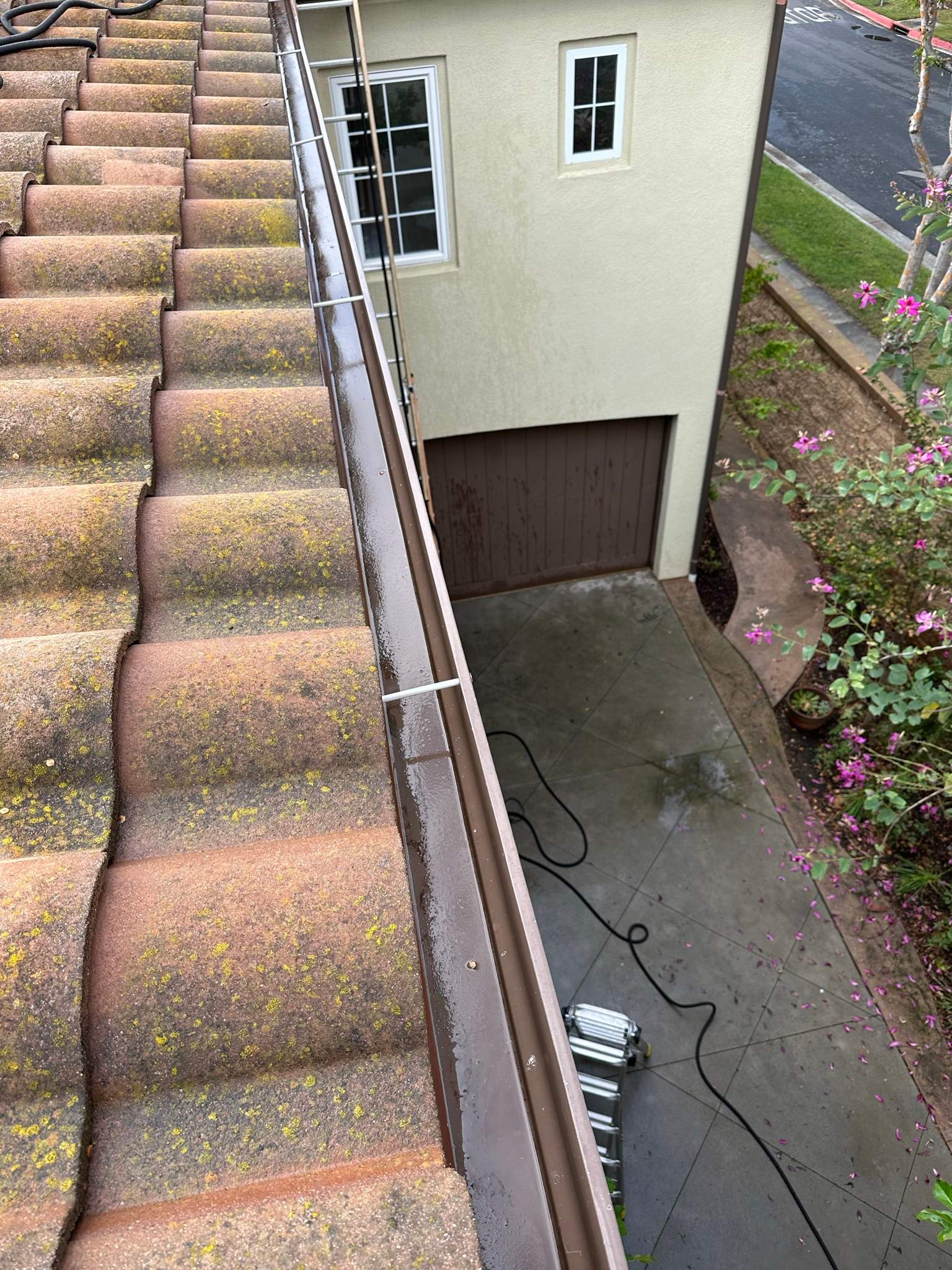 Clogged gutters at this Irvine home in Woodbury by Property Cleaning Experts, LLC