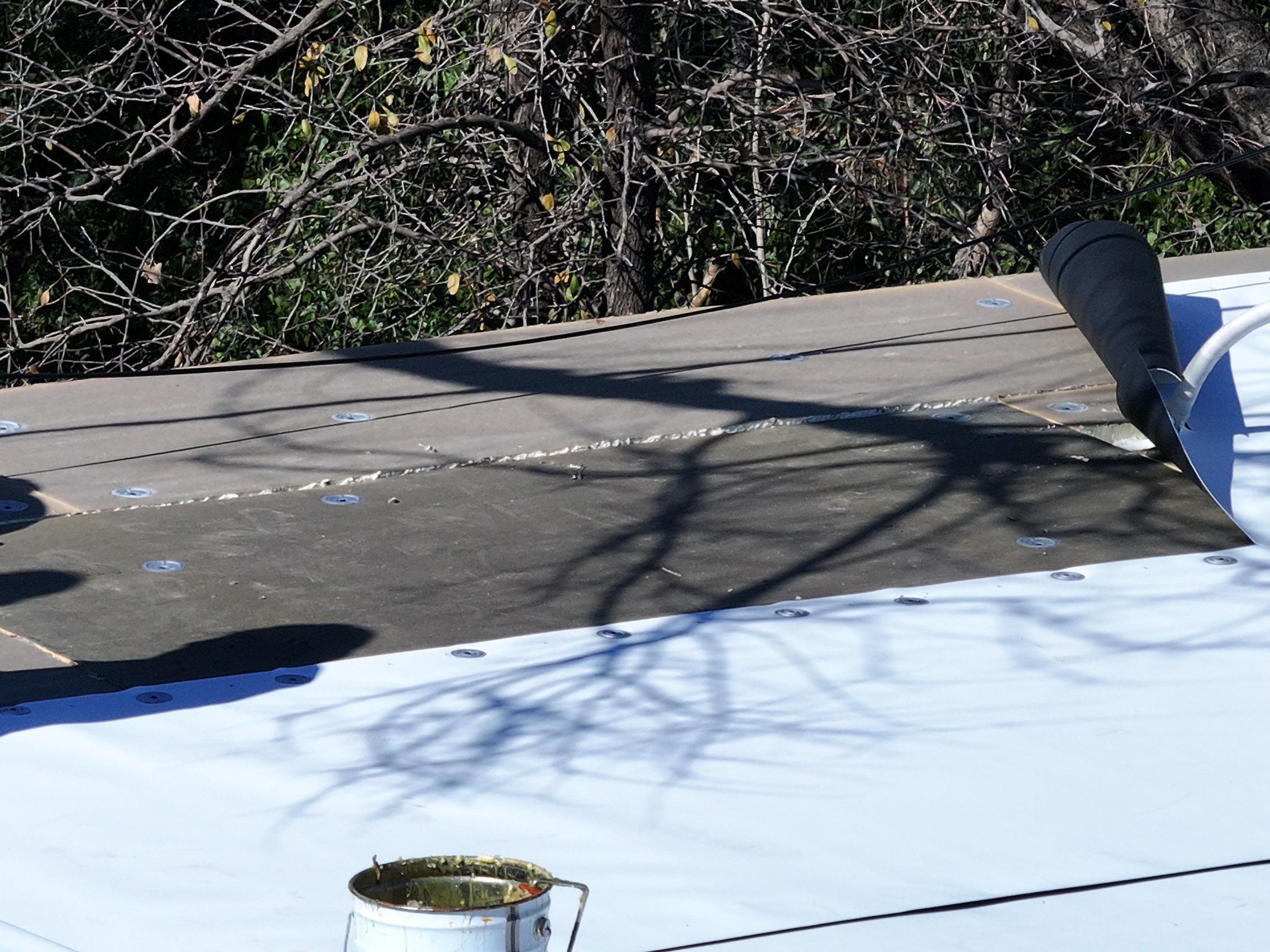 Commercial roofing overlay using GAF TPO over an old ballast roof by Becker Roofing and Exteriors