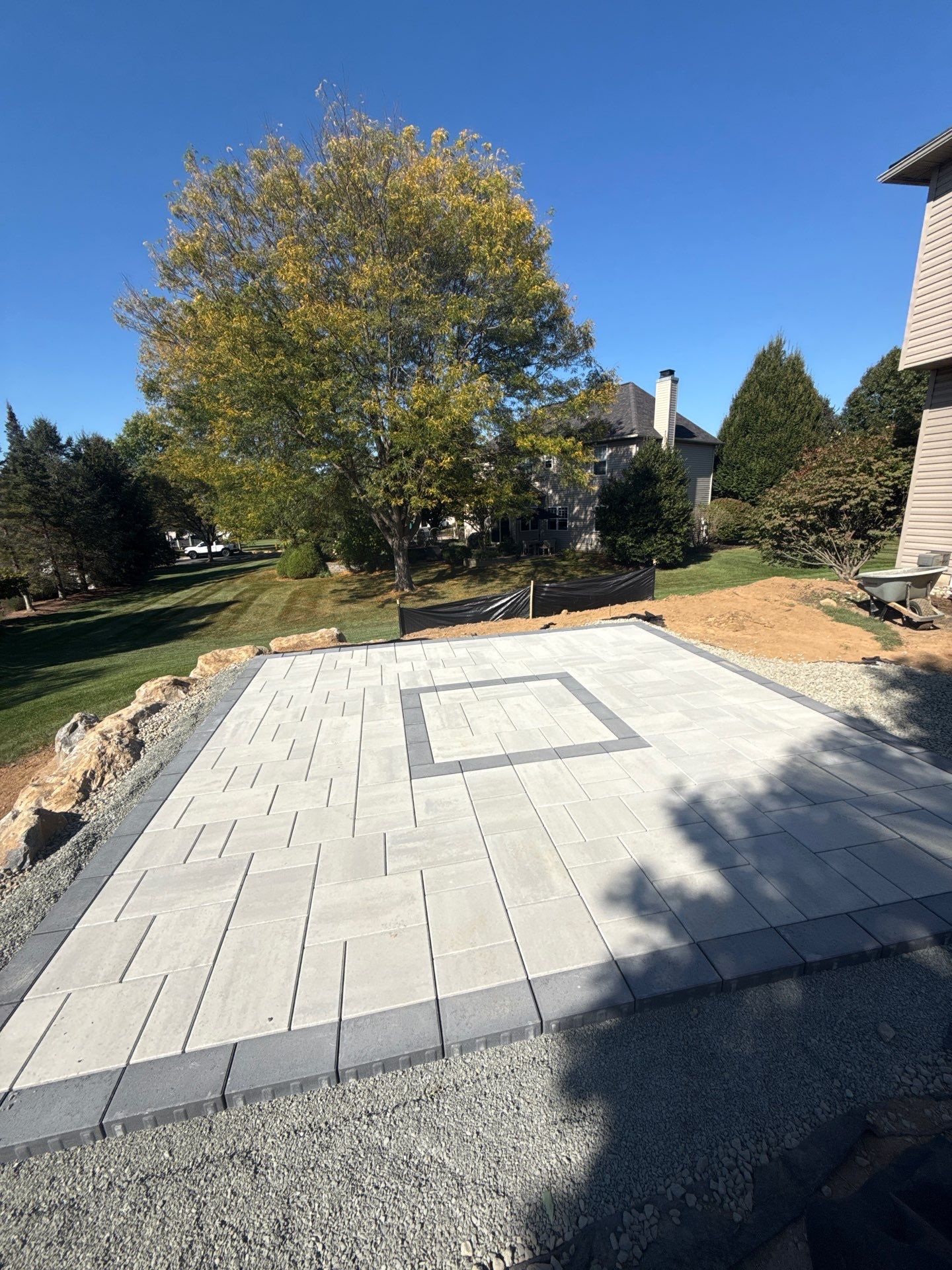 Backyard Retreat: Techo-Bloc Patio + Firepit Lounge by Saylor’s Lawn & Landscape