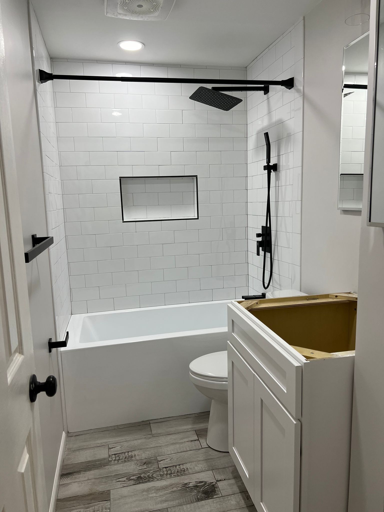 Bathroom Remodel using Cabinets by Home Concepts Construction