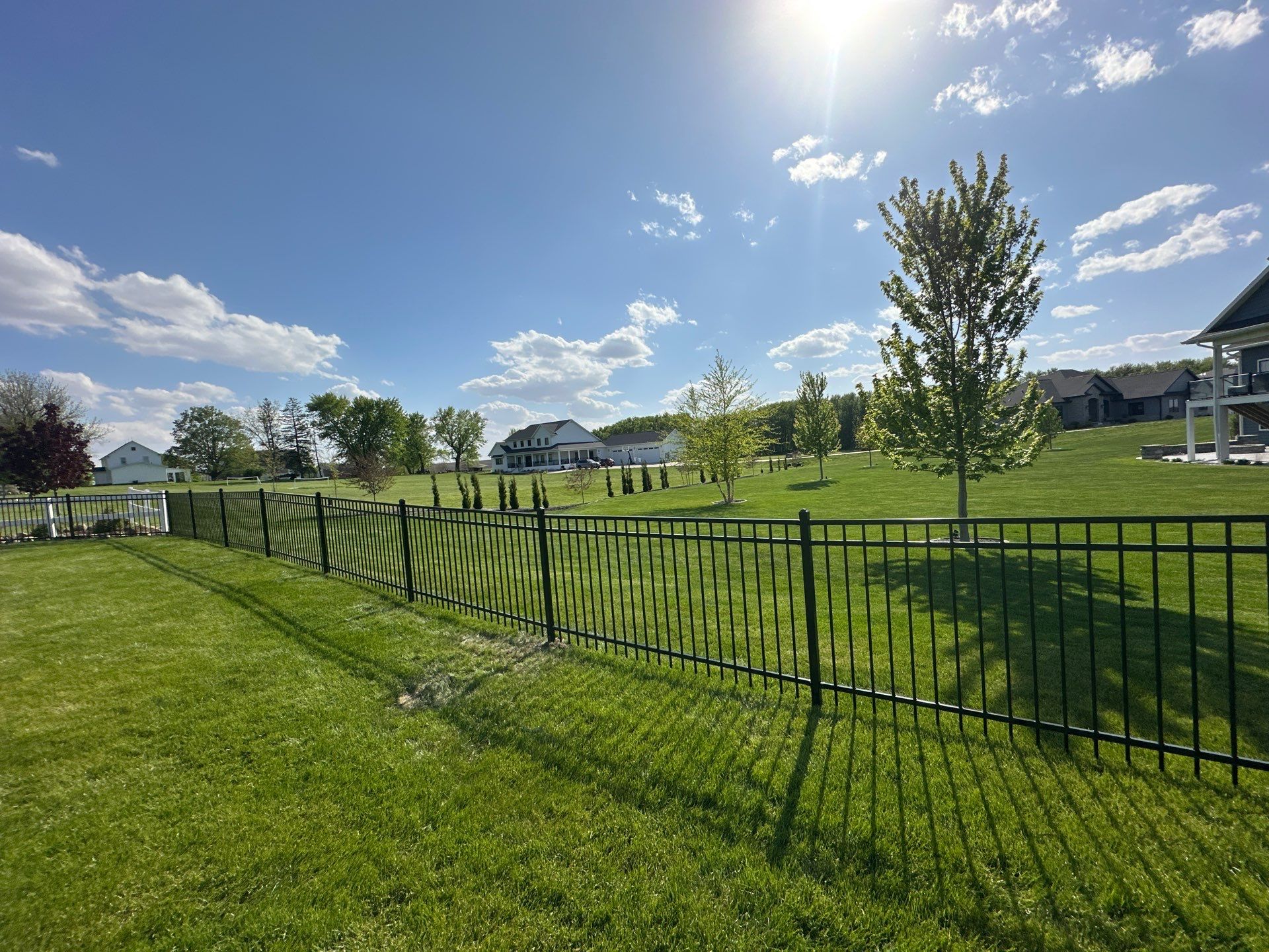 Black Ornamental Metal Picket Fence Installation in Waterloo by Perfect Picket Fence and Stain
