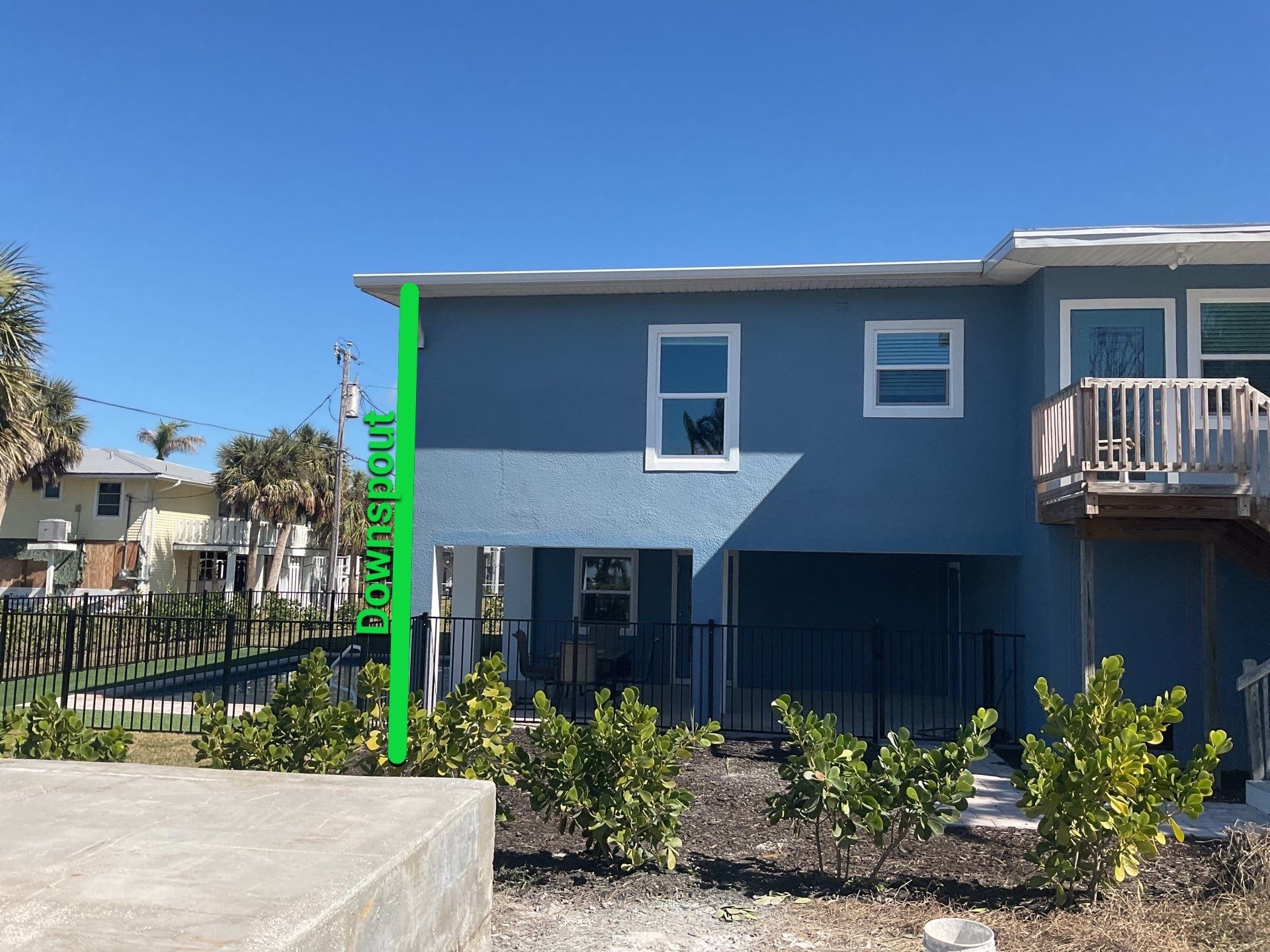 Downspout Installation for Two-Story Home in Fort Myers FL by Gutter Professor by Gutter Professors