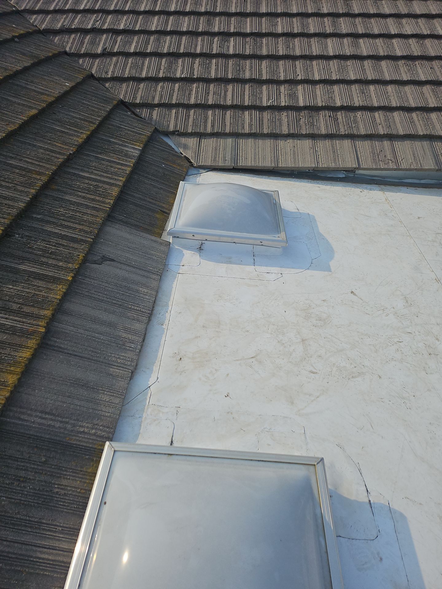 Single-ply roofing system on porch using TPO 60 mil by Straight Edge Roofing Inc