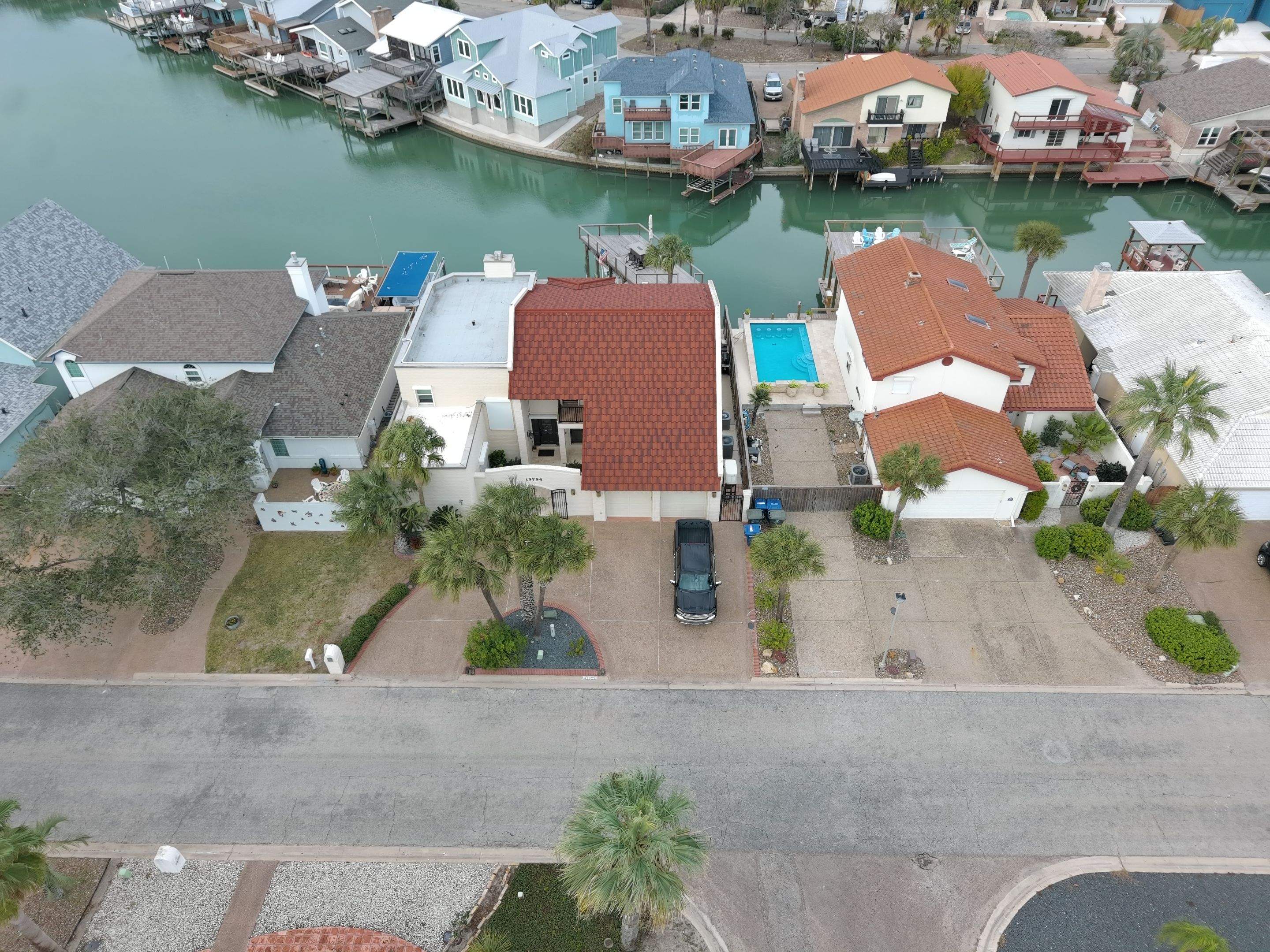 Off with the Tile and on with the TILCOR stone coated metal.  by Bayfront Roofing and Construction