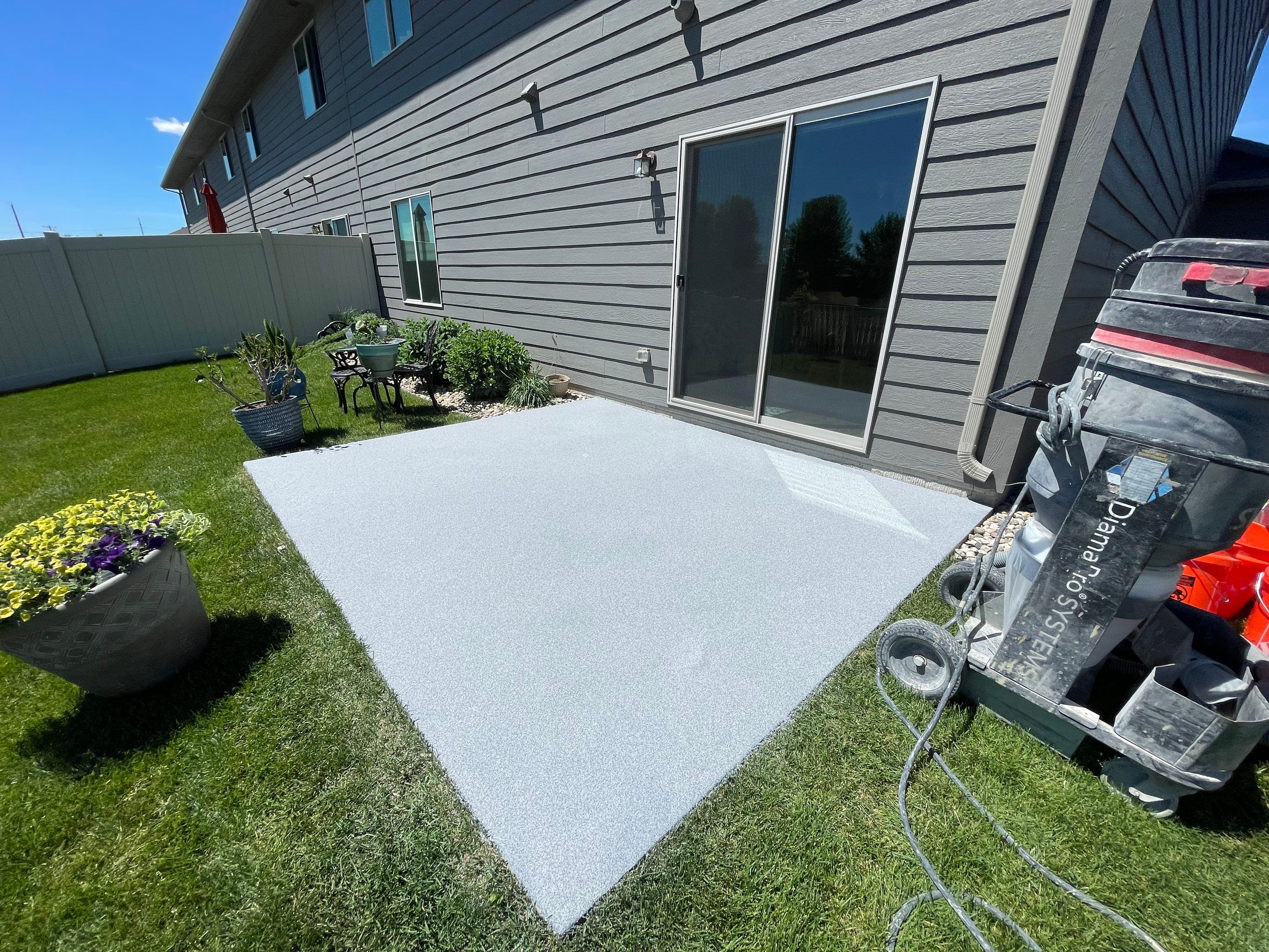 Custom Concrete Coating for Sioux Falls Patio and Front Walkway by Select Painting, Coatings & Garage Cabinets