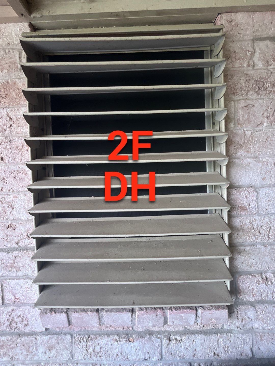 Colored Vinyl Windows to blend into brick by Bayfront Roofing and Construction