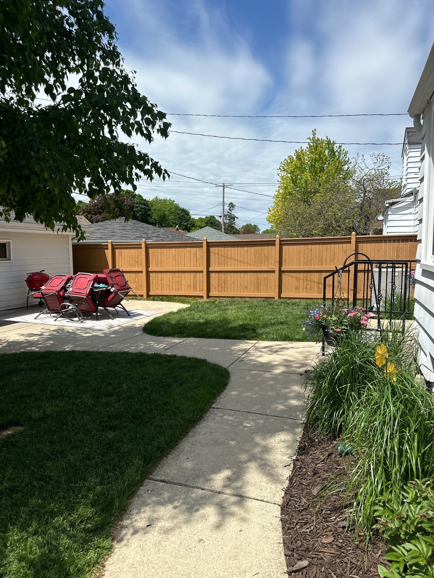Milwaukee Wood Privacy Fence Installation and Concrete Patio Upgrade by OCS Contracting Services