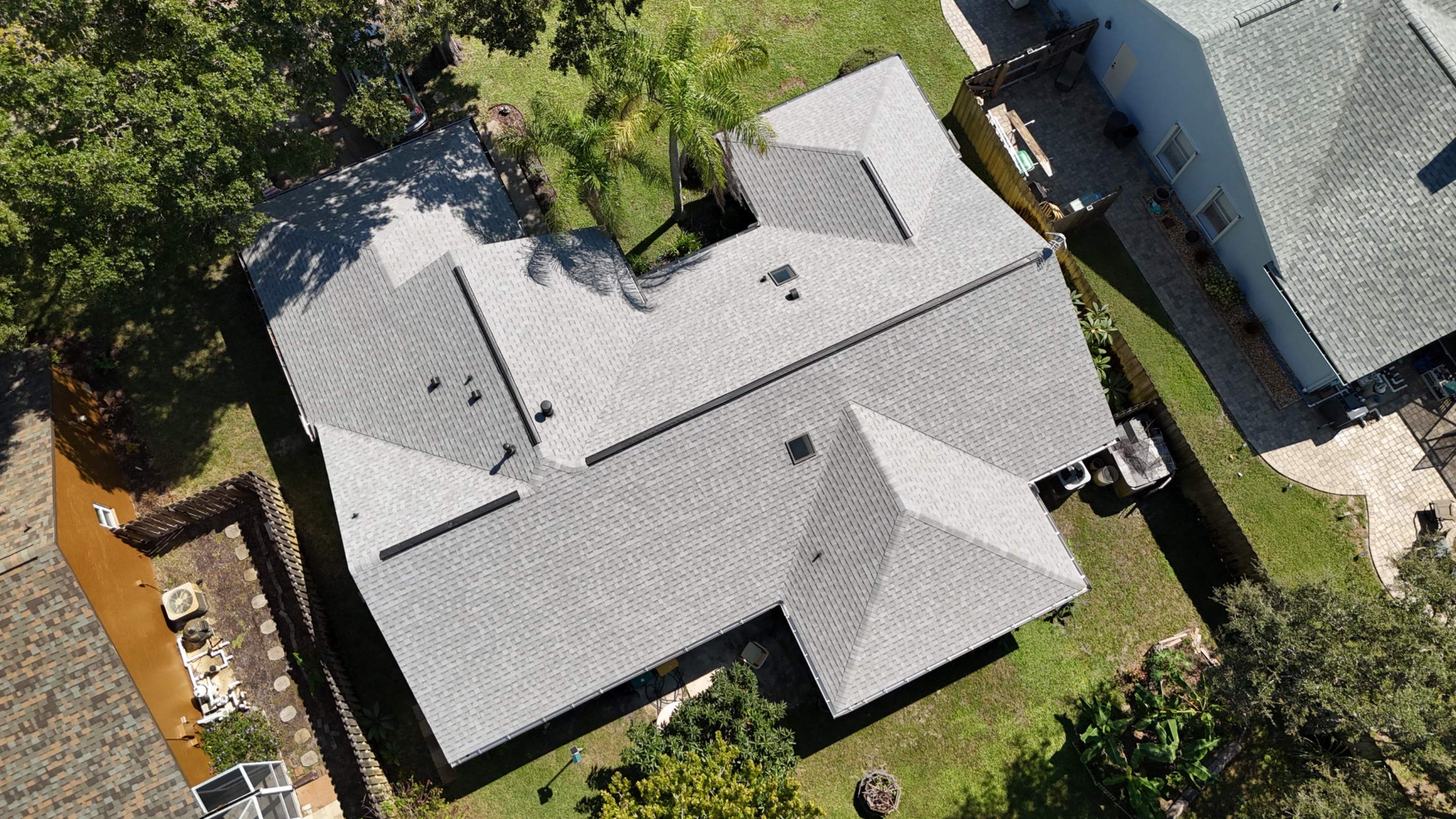 Comprehensive Roof Replacement w/ Old English Pewter Shingles & Black Ridge Vent in Melbourne by Wiedmann Construction & Roofing