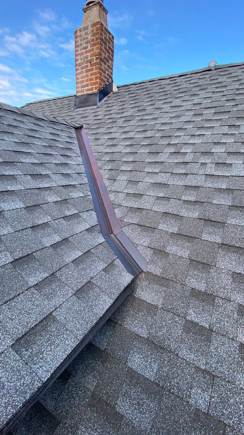 Asphalt Roof, Vinyl Siding, and Aluminum Gutter Replacement by Custom Installations