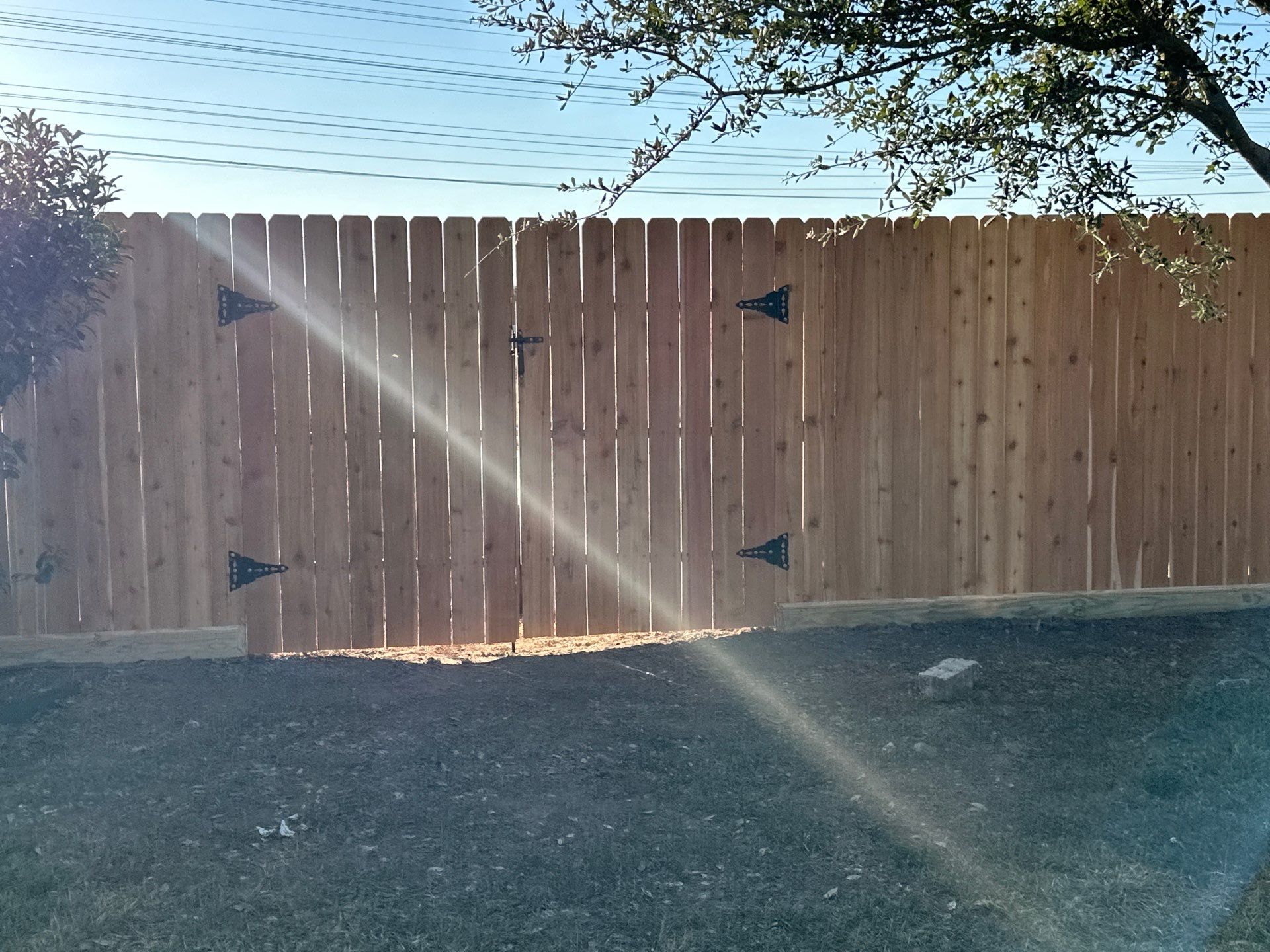 Beautiful Wood fence with metal posts by Tim's Fences