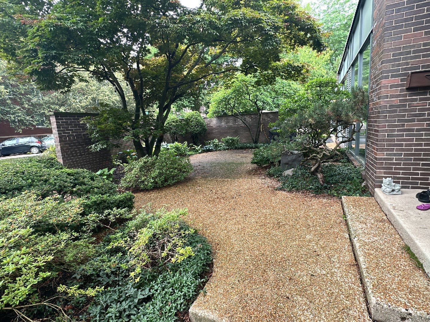 Aggregate and natural stone patio cleaning by Northern Power Washing LLC.