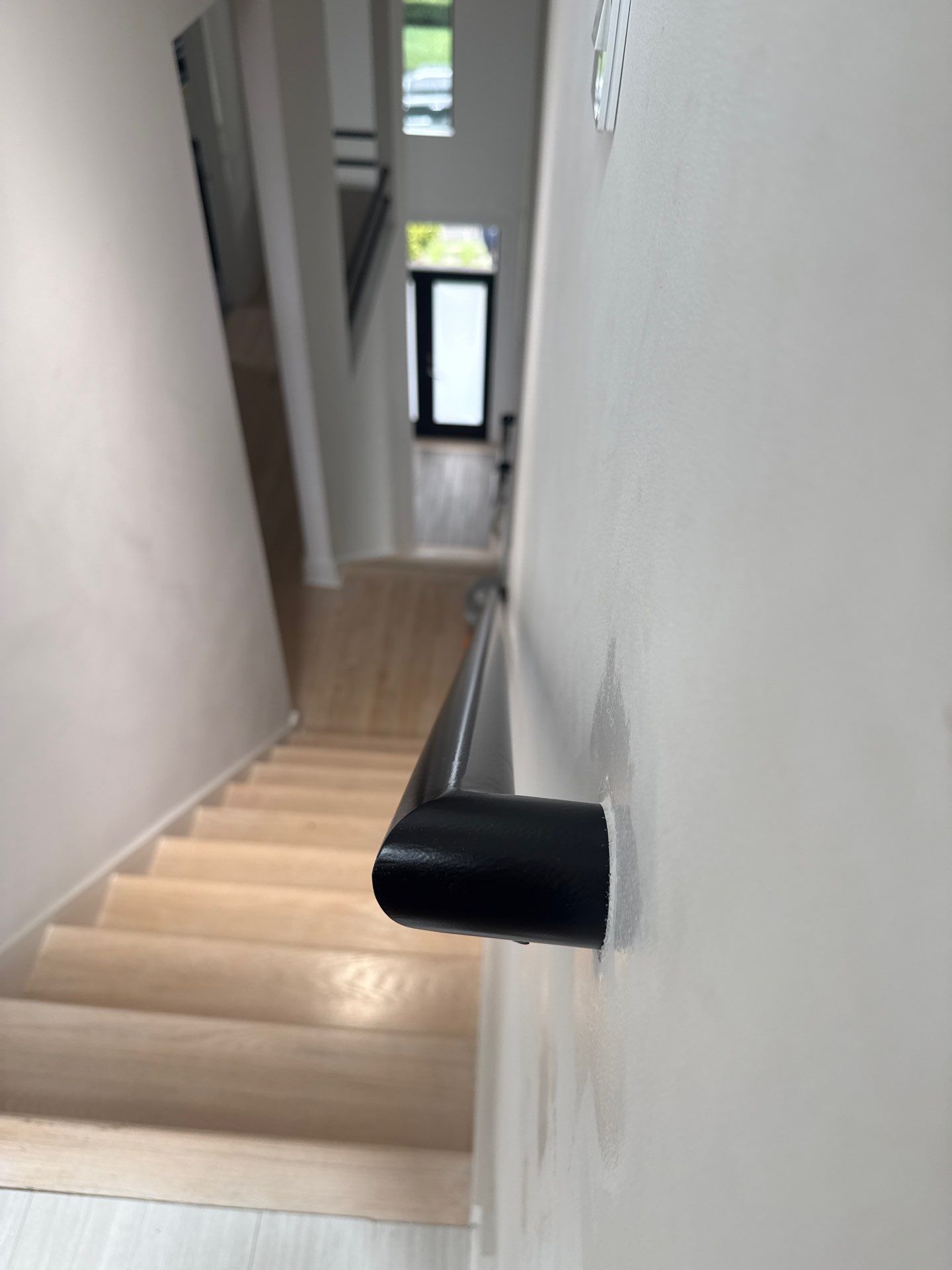 Two Black Metal Handrail Installation Across Multi-Level Washington Staircases by Capitol Iron Works